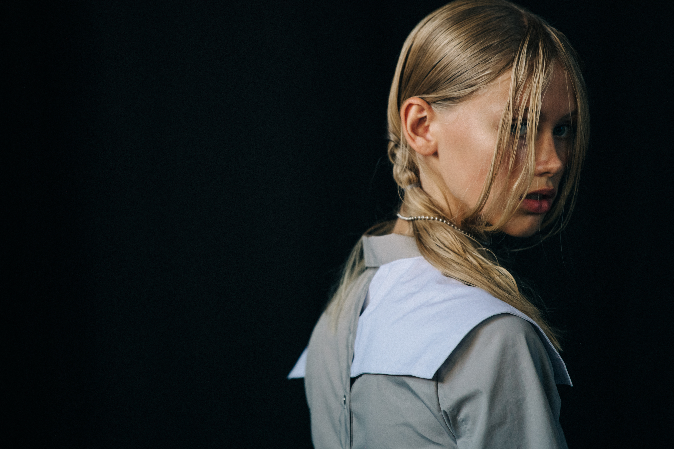 Model wearing white outfit at Heliot Emil