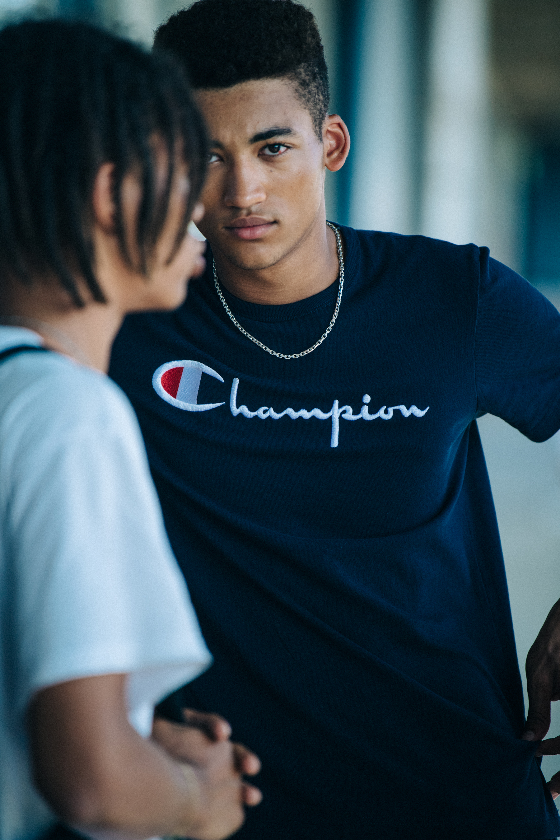 Model wearing black tee shirt at J Lindeberg