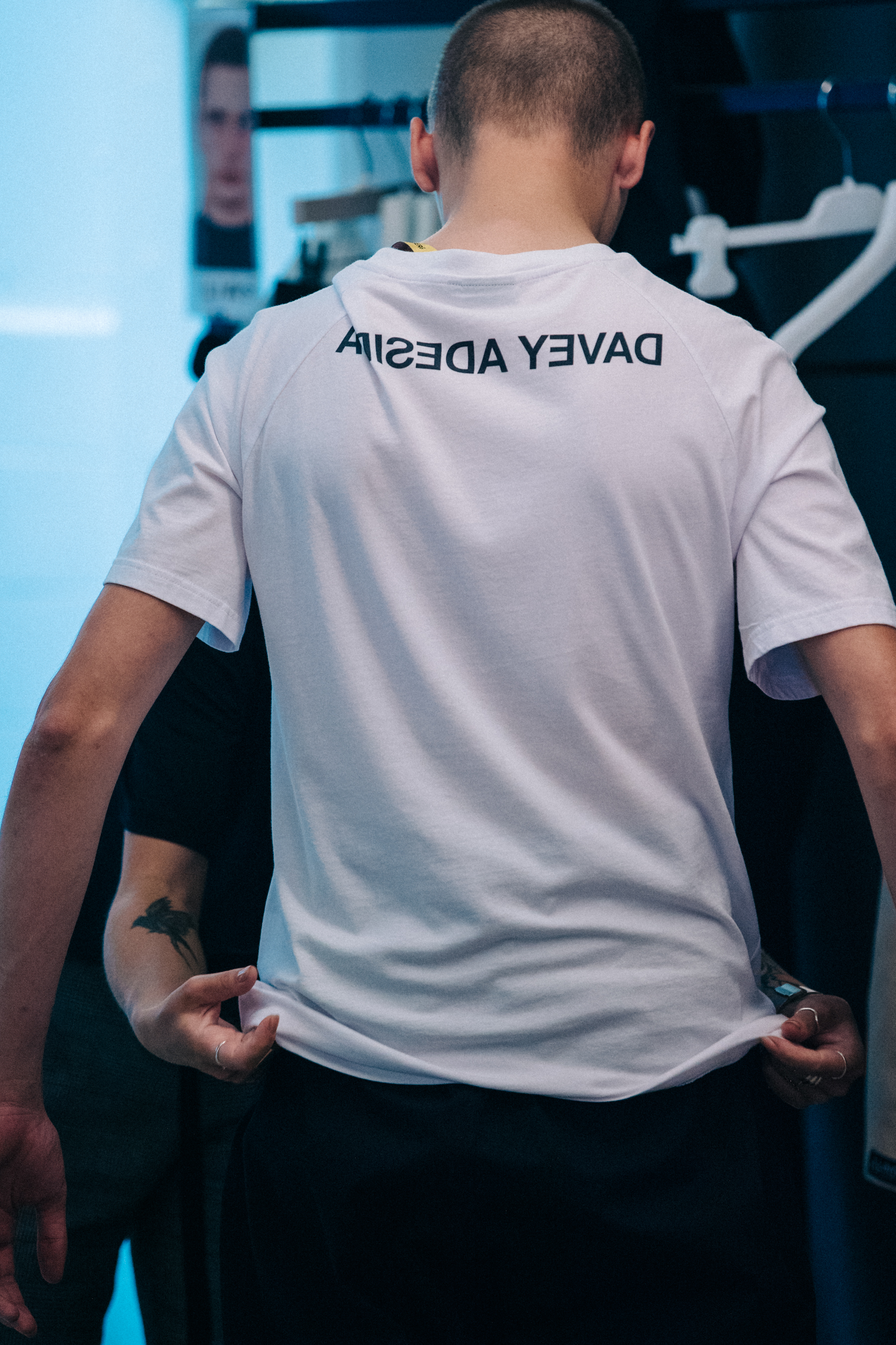 Model wearing white tee shirt at J Lindeberg