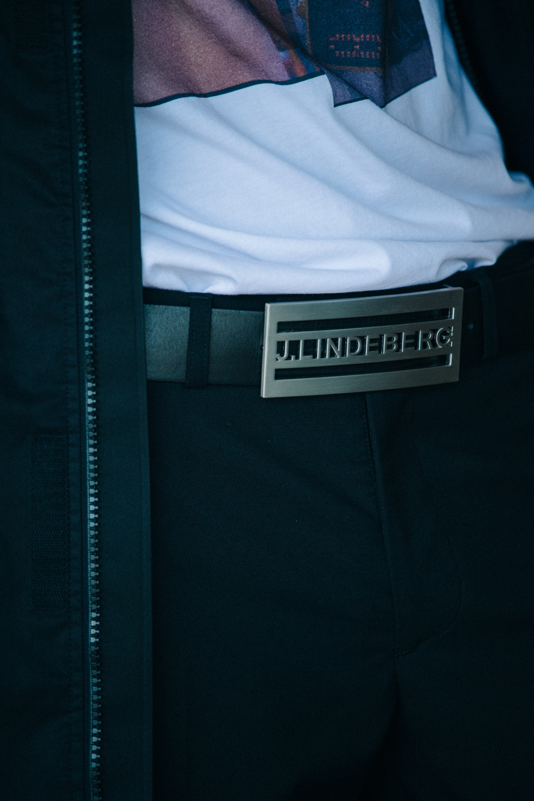 Model wearing silver belt buckle