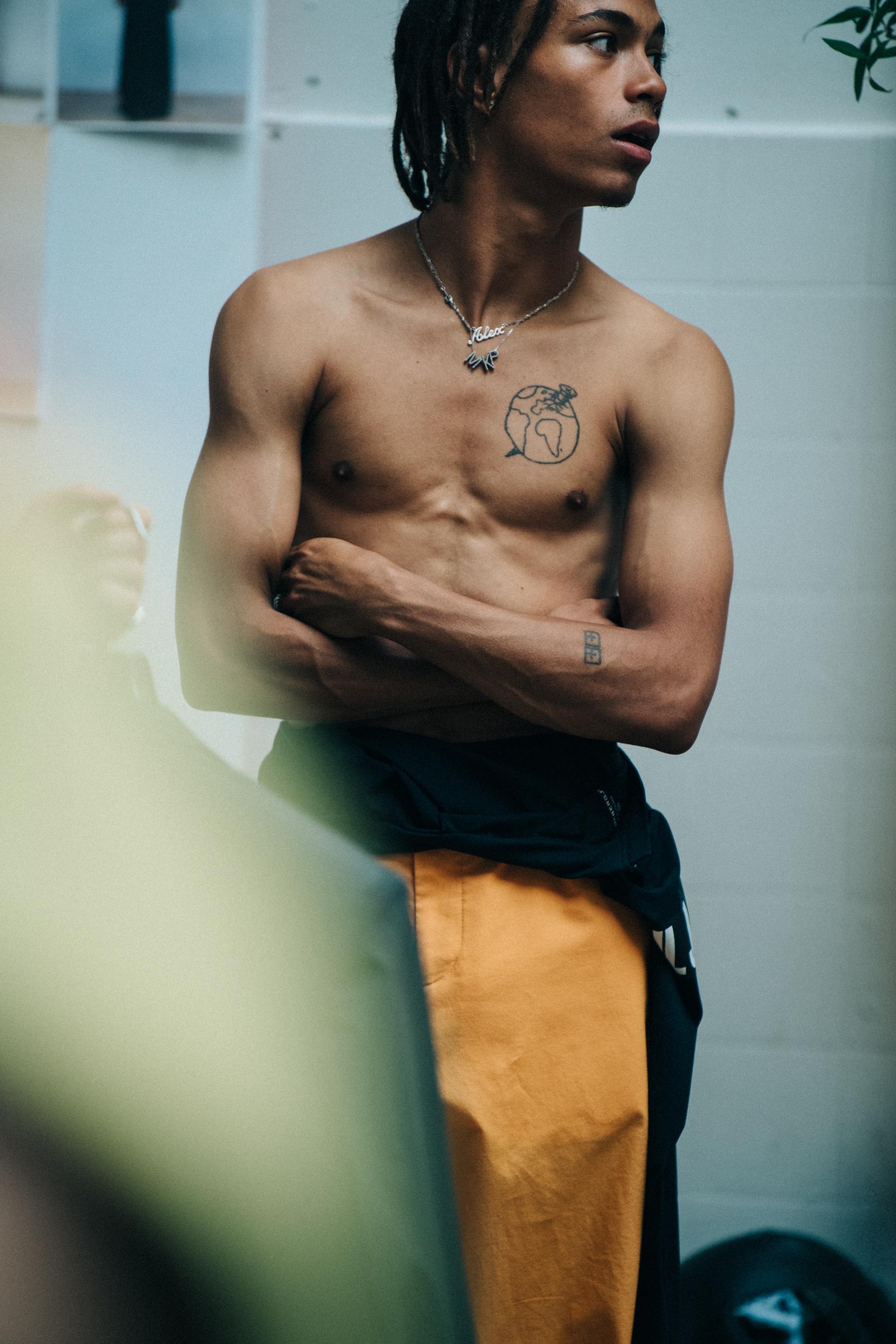 Topless model backstage at J Lindeberg