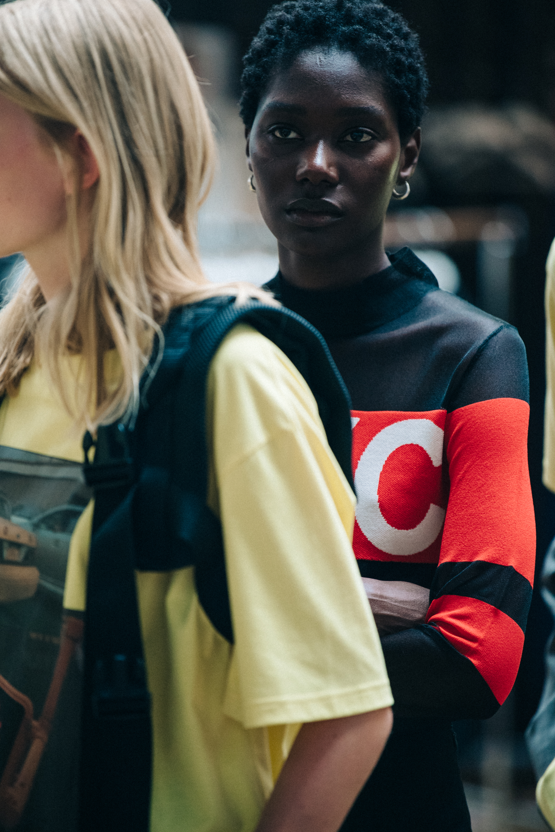 Model wearing red J Lindeberg top backstage