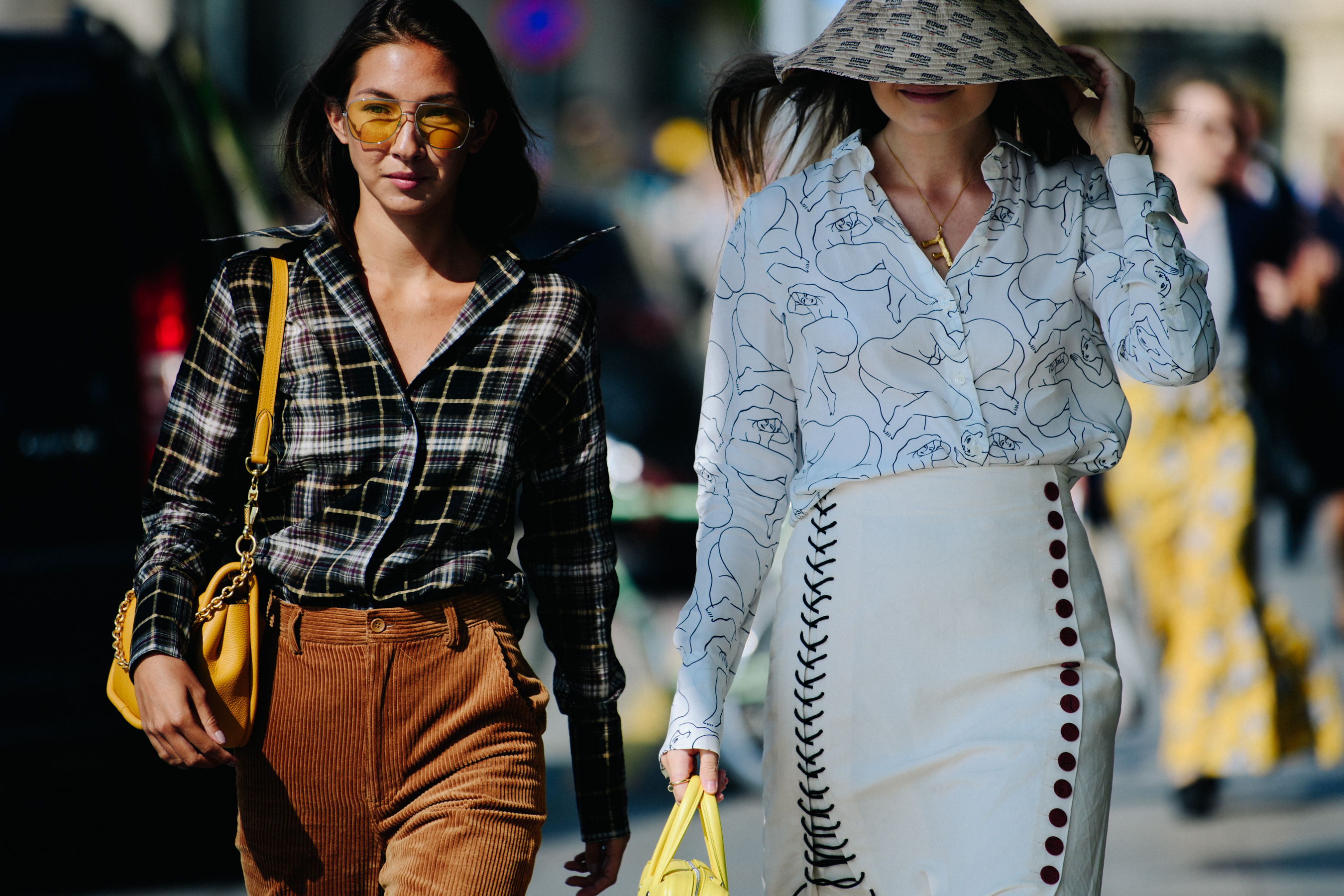Two women wearing pattern shirts