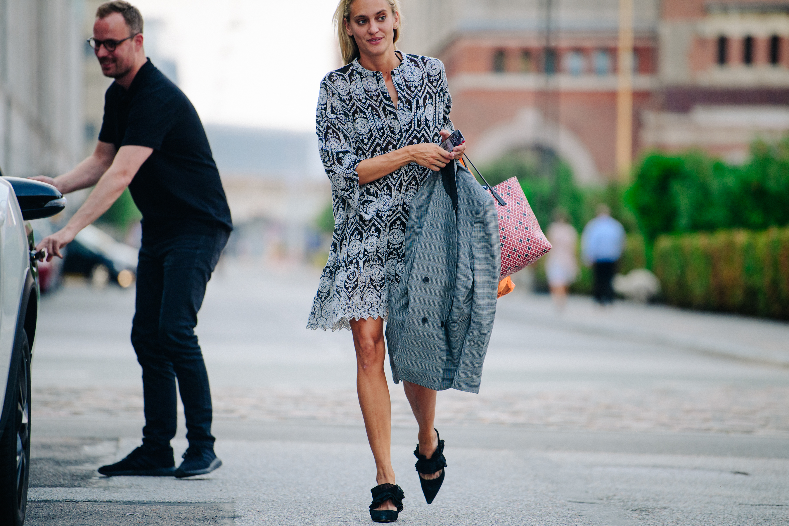 Woman wearing black and white pattern dress