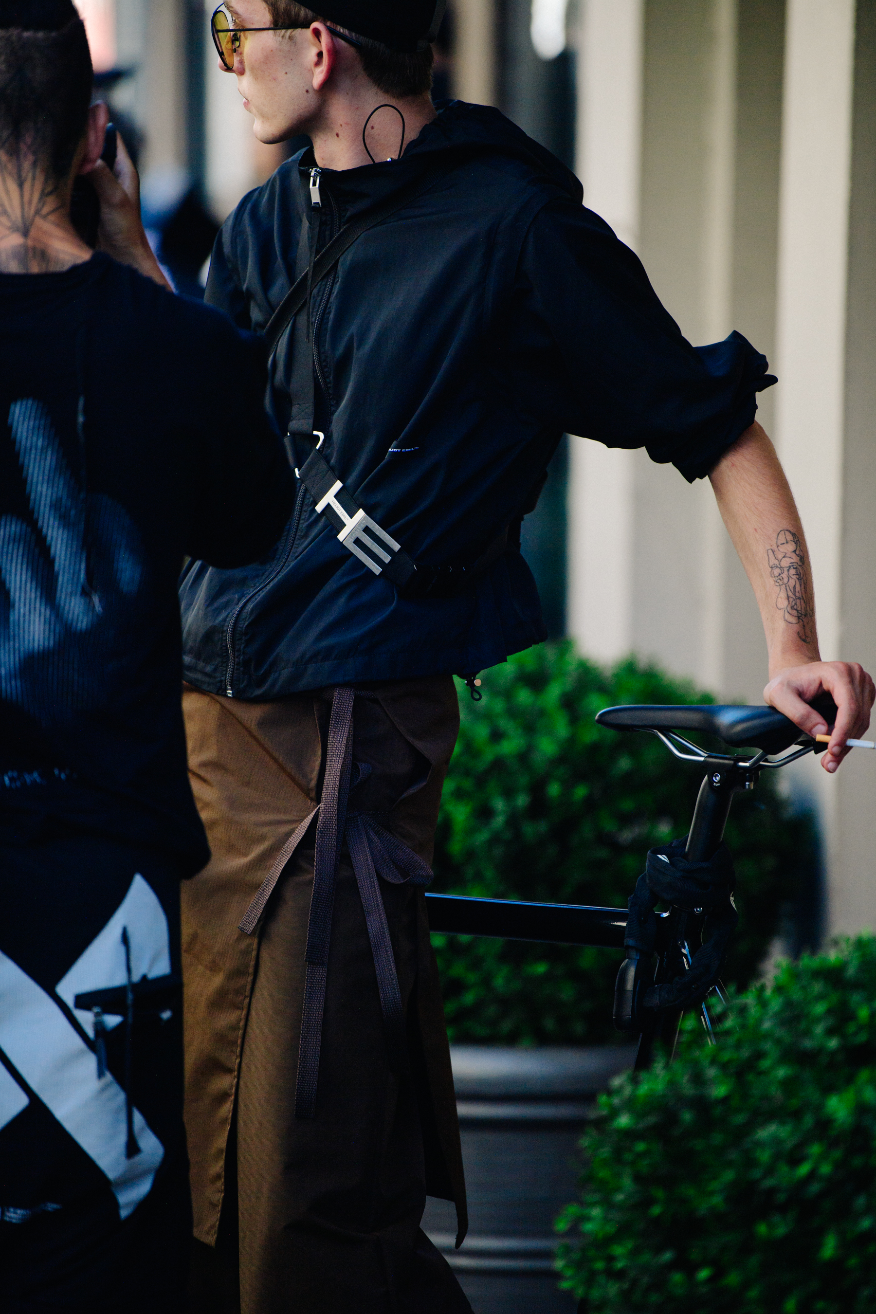 Man wearing brown apron and pants