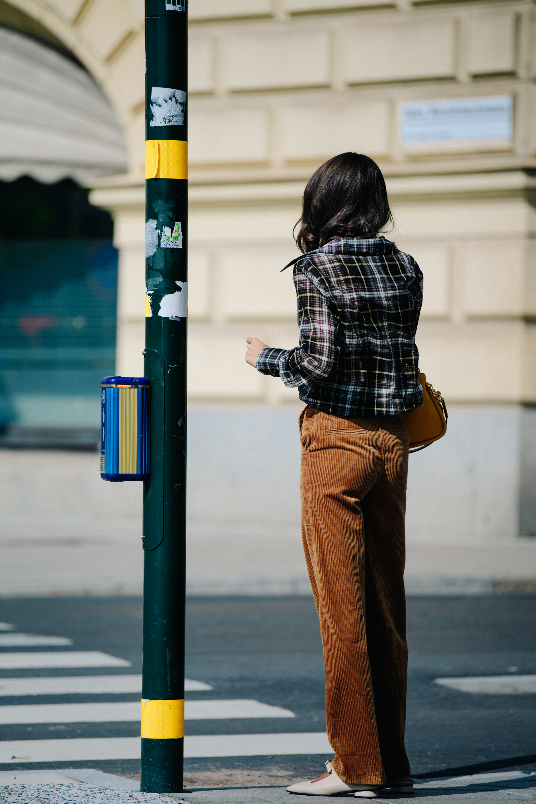 Woman wearing brown corduroy pants