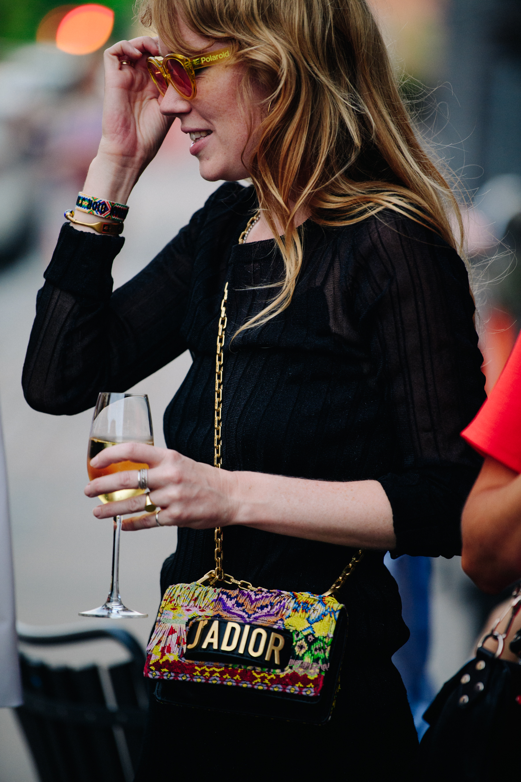 Woman carrying Christian Dior bag