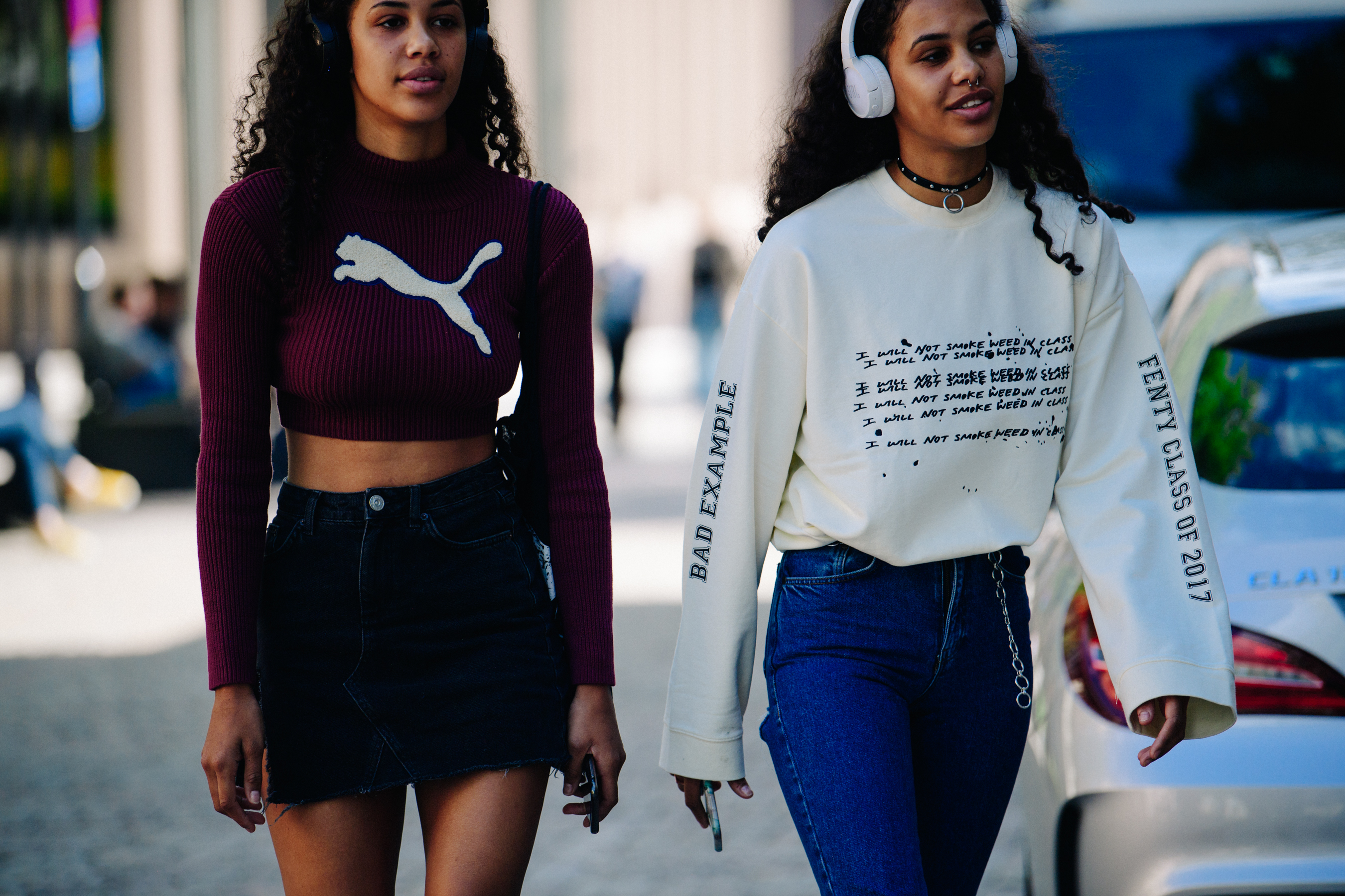 Model twins wearing headphones