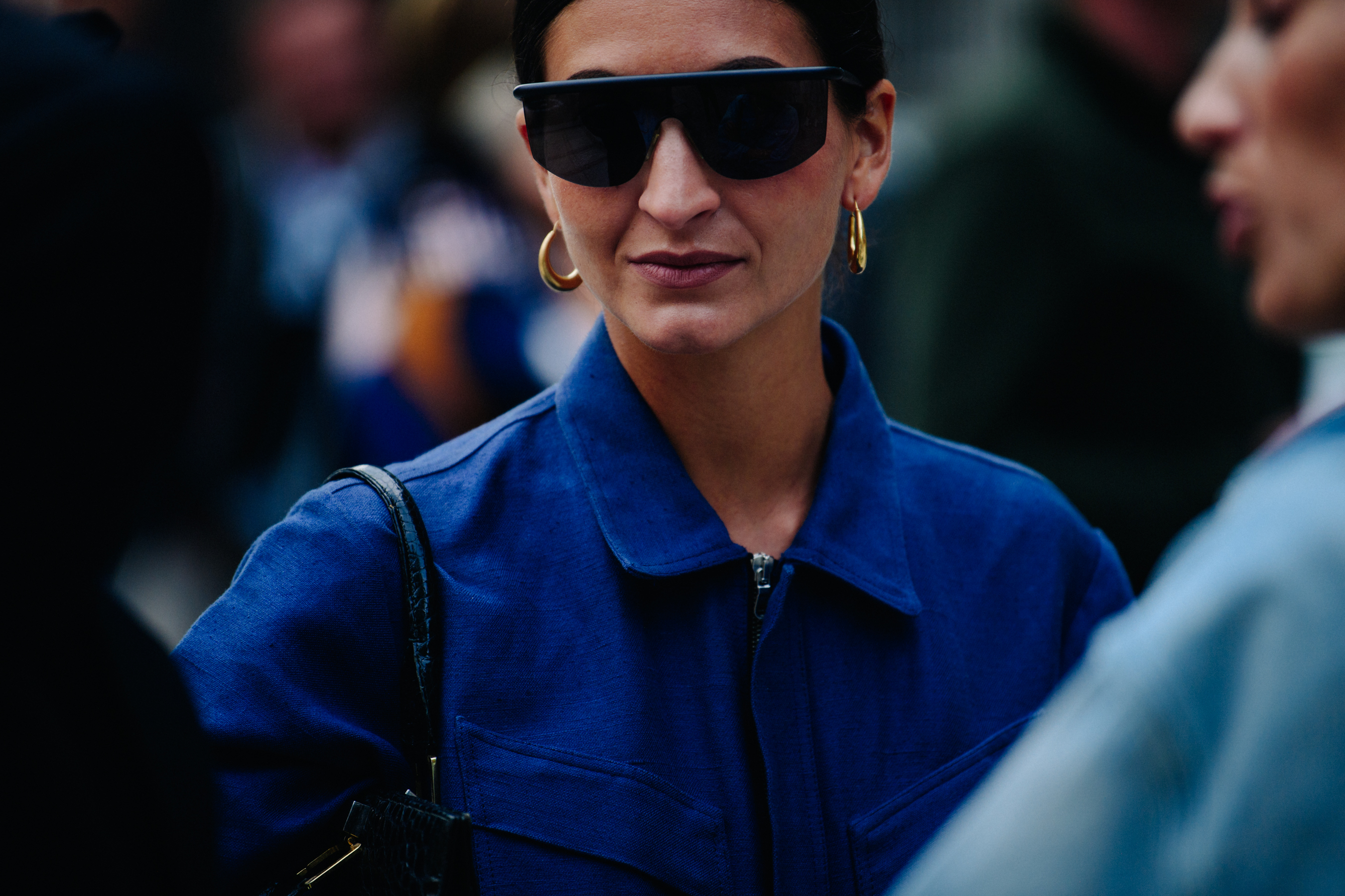 Woman wearing blue zip up shirt