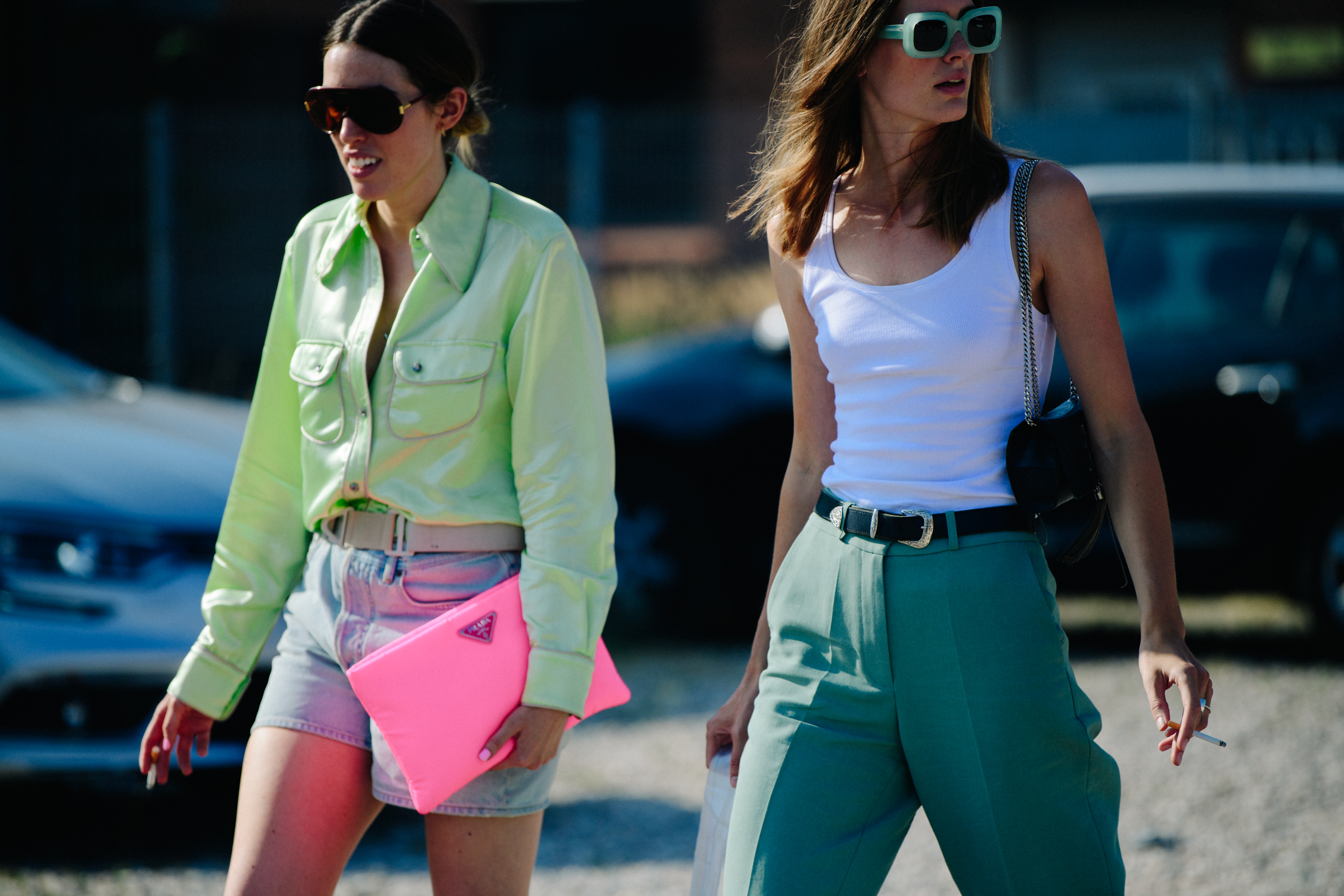 Two women wearing green