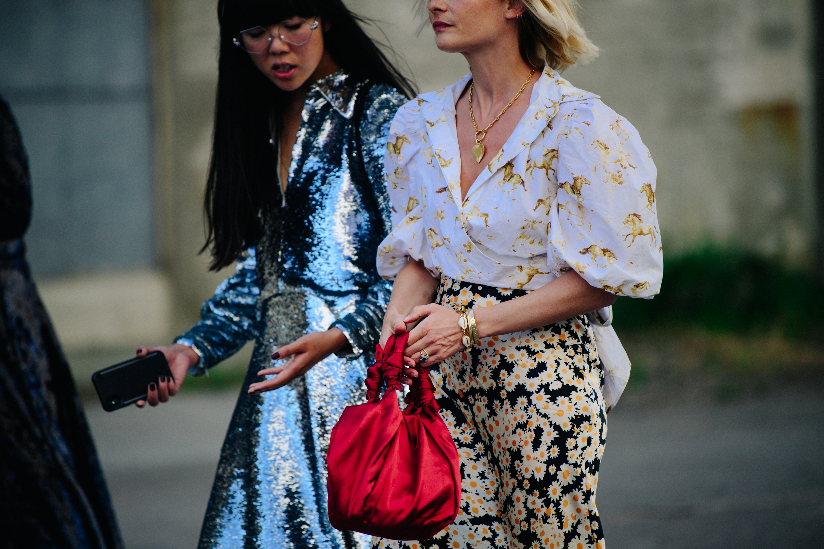 Two women wearing pattern outfits