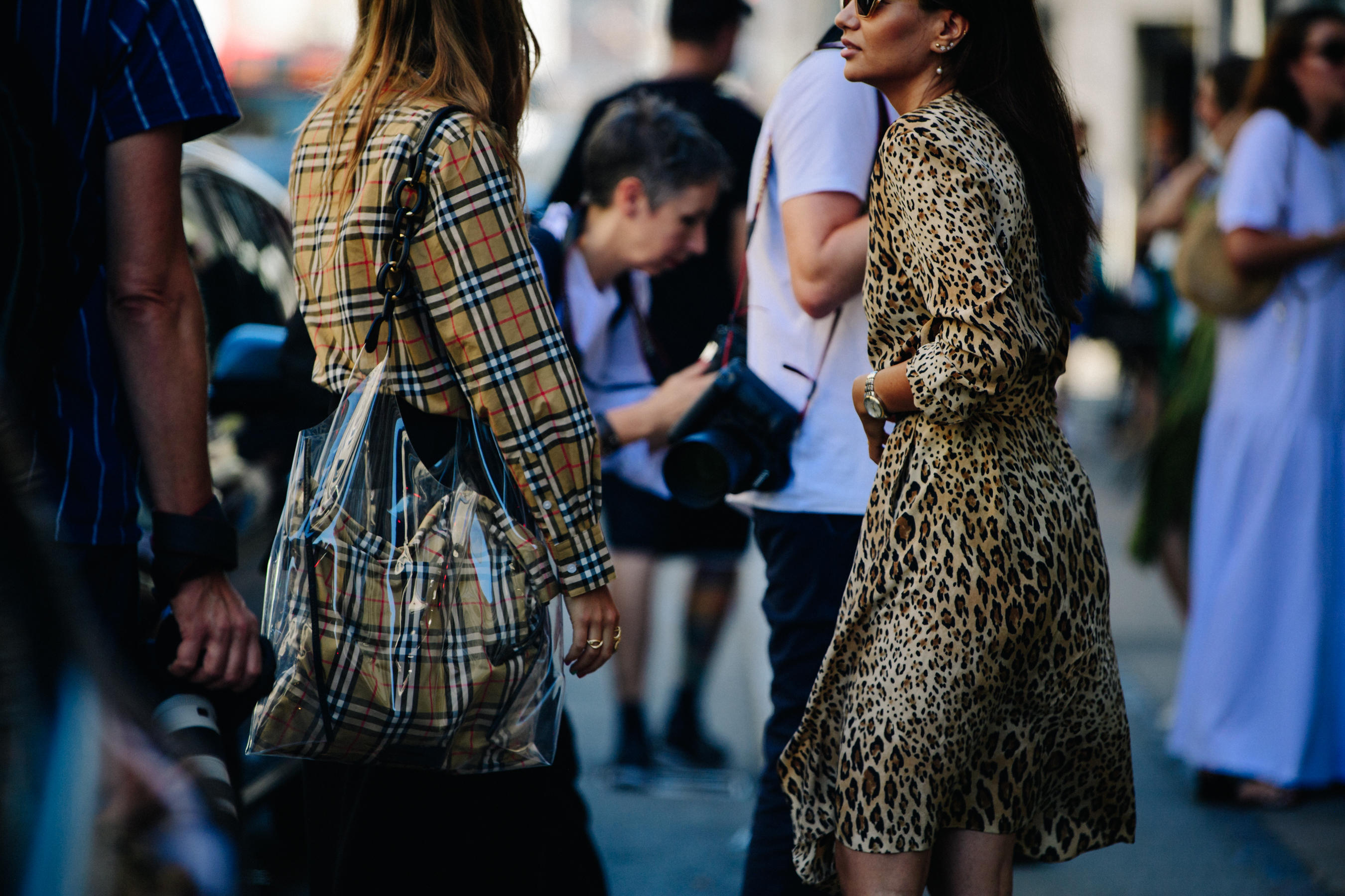 Two women wearing pattern outfits