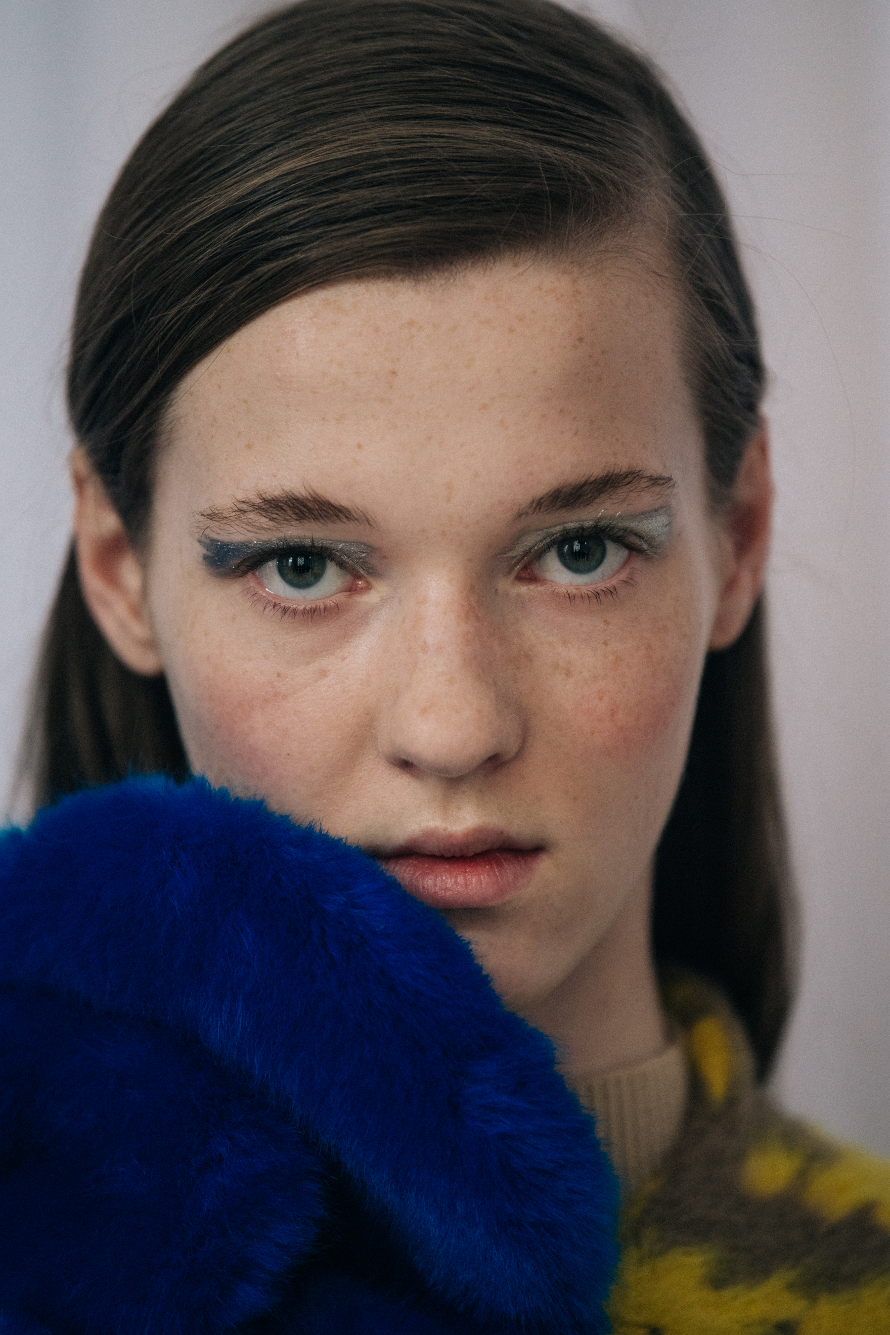 Portrait of model with blue furry accessory