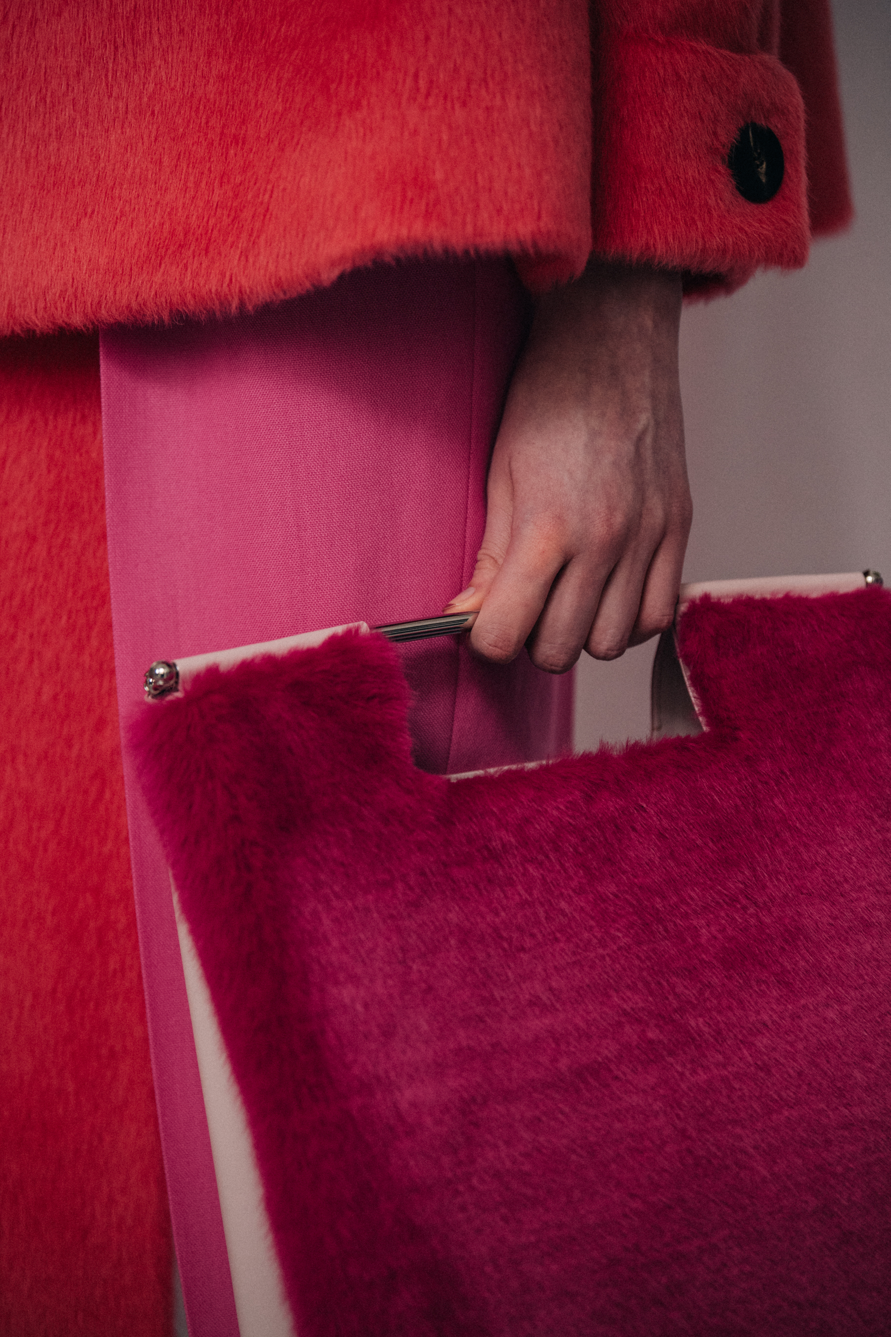Model wearing red fur at Delpozo