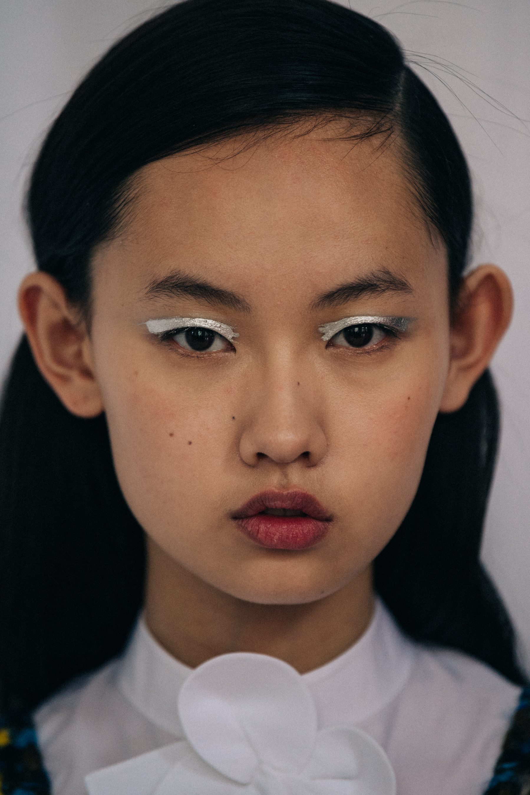 Portrait of model with silver eye shadow