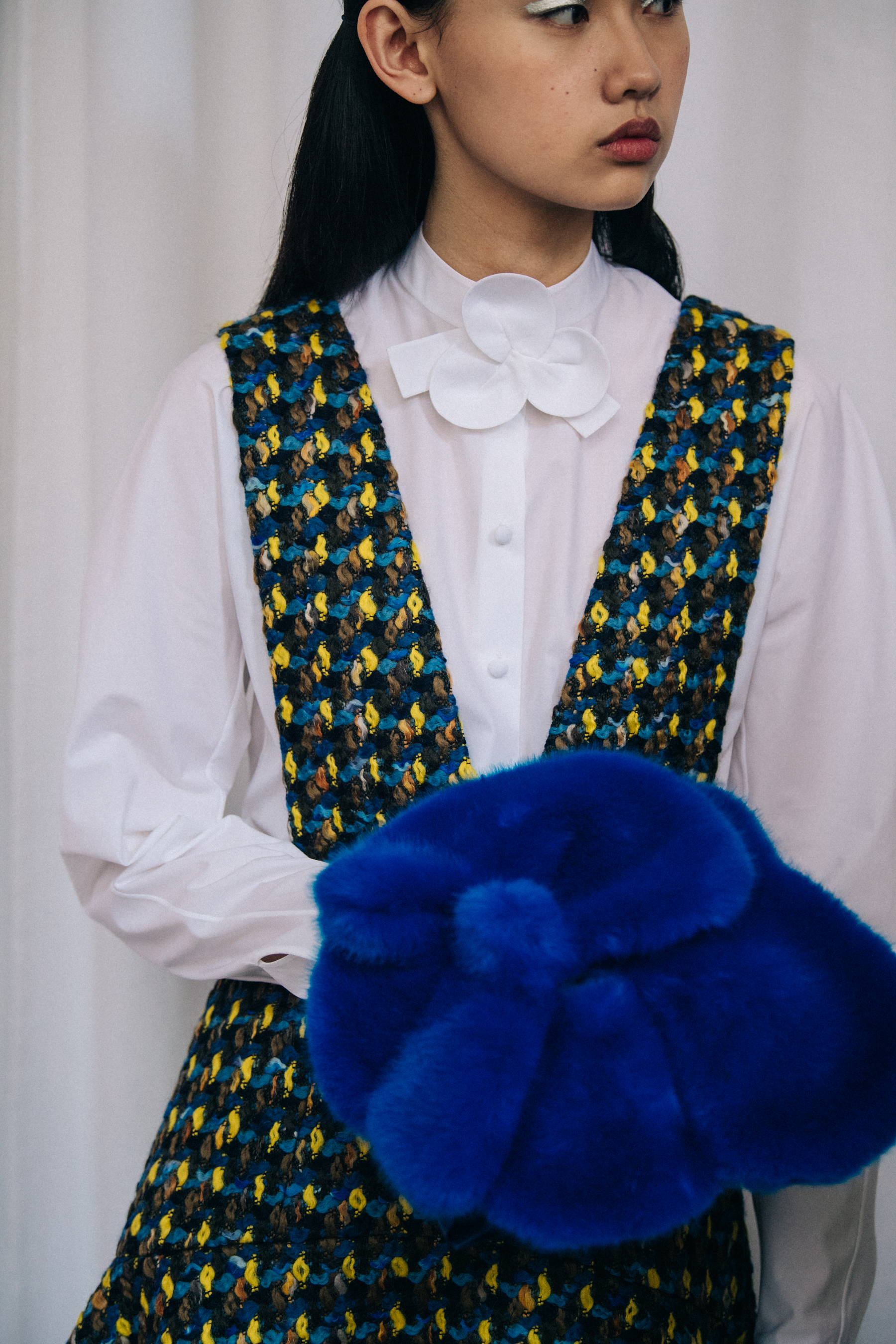 Asian model wearing white shirt at Delpozo