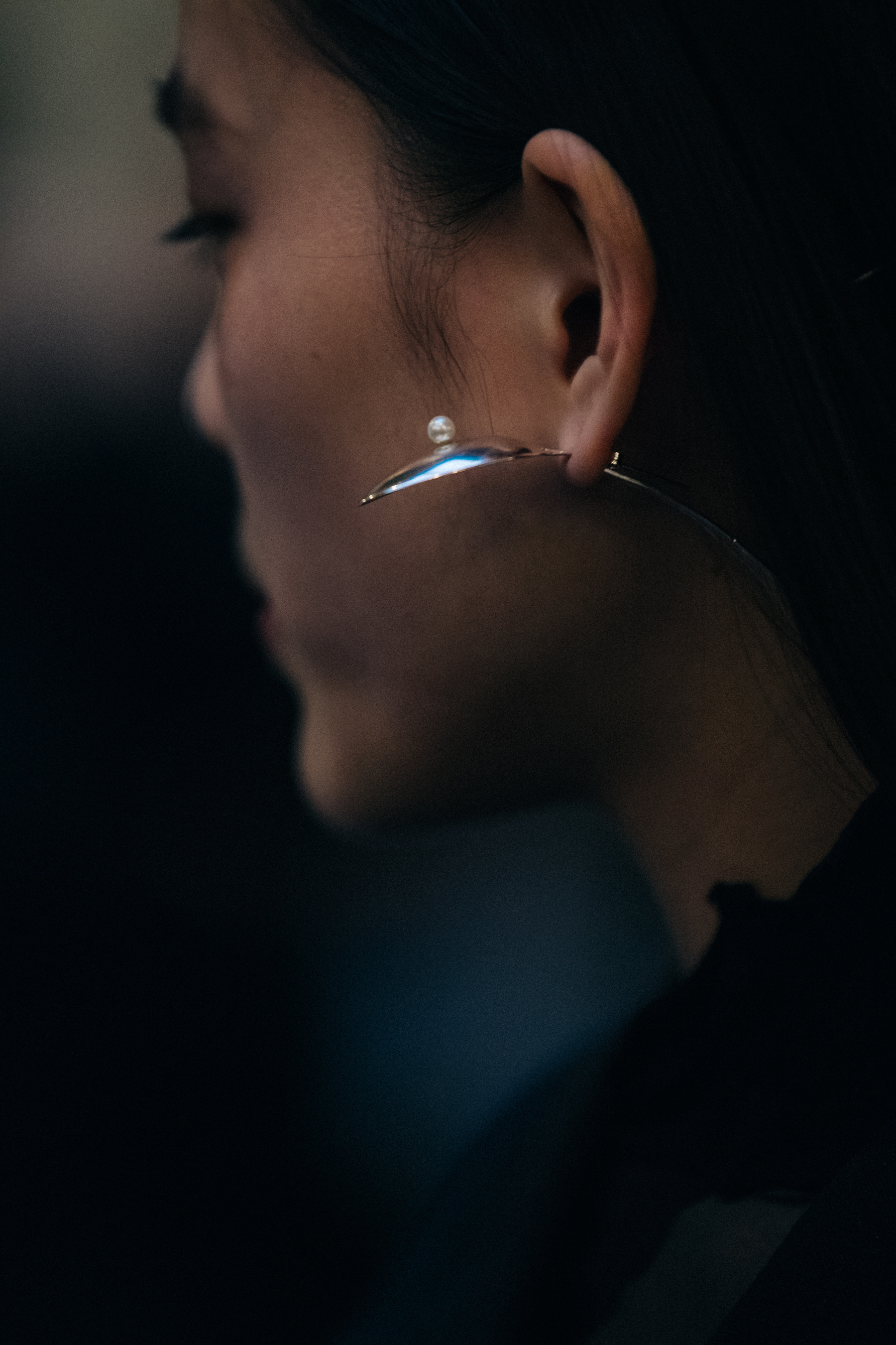 Model wearing silver earring at Freya Dalsjo