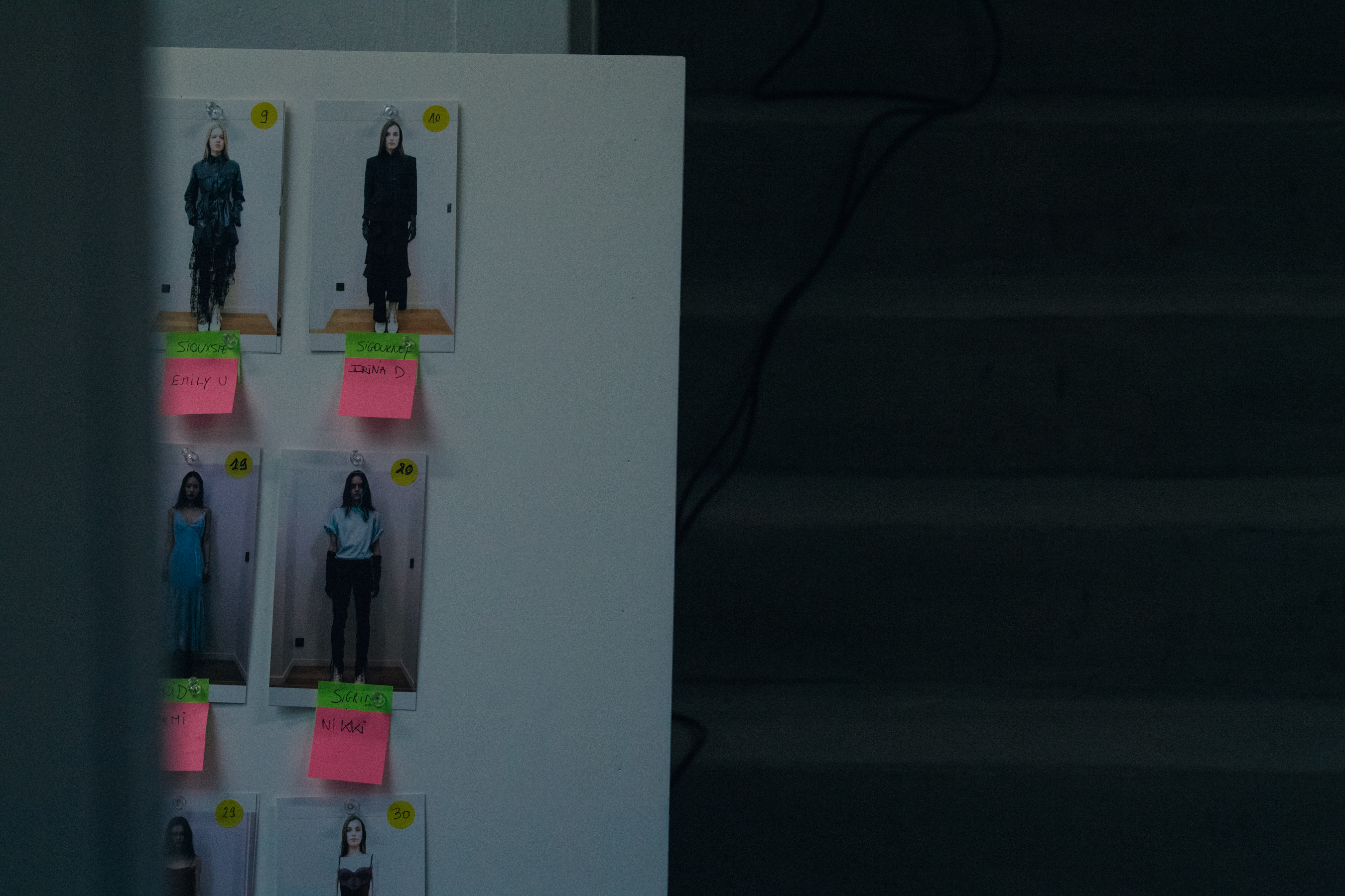 Model polaroids board backstage