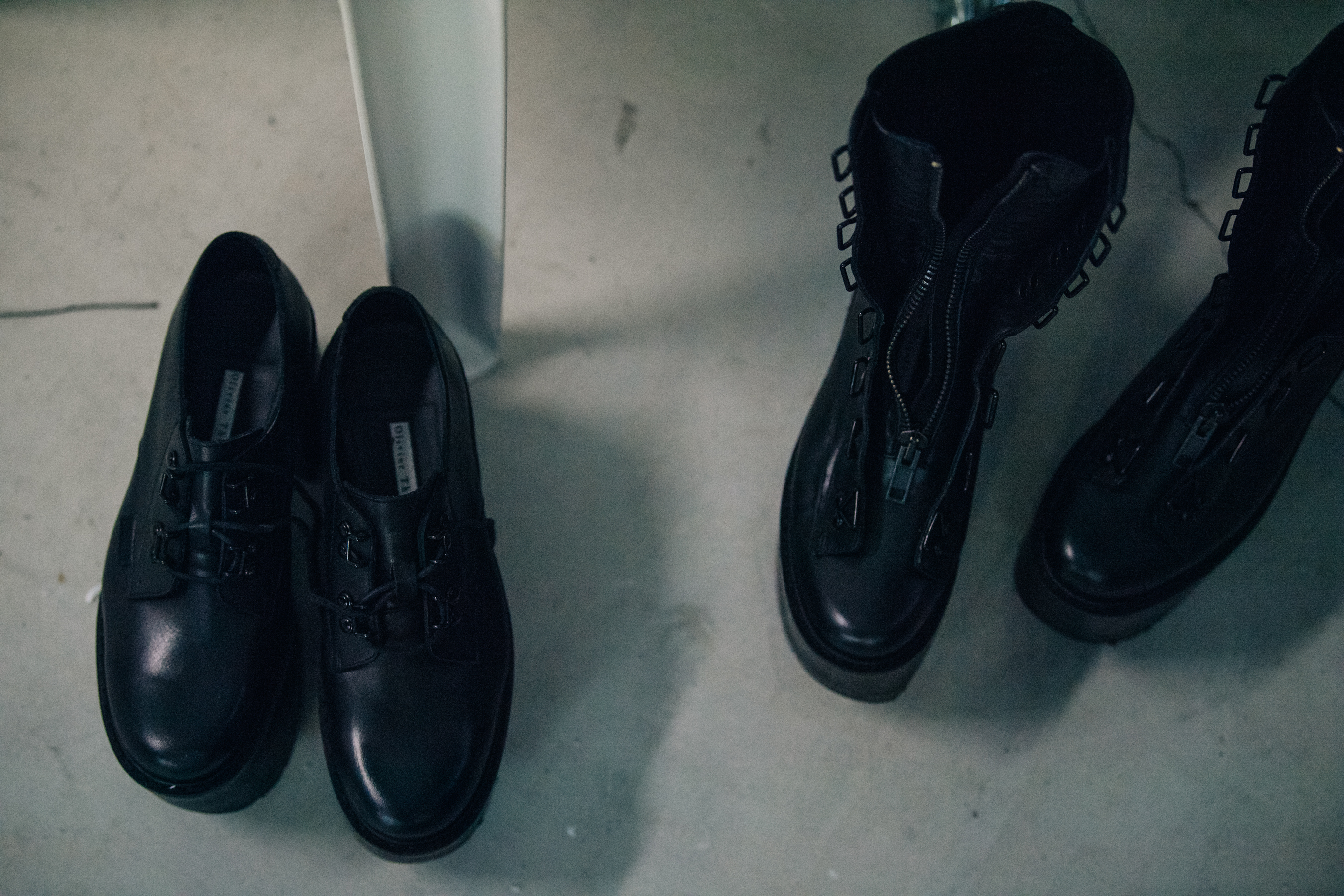 Models shoes backstage at Olivier Theyskens