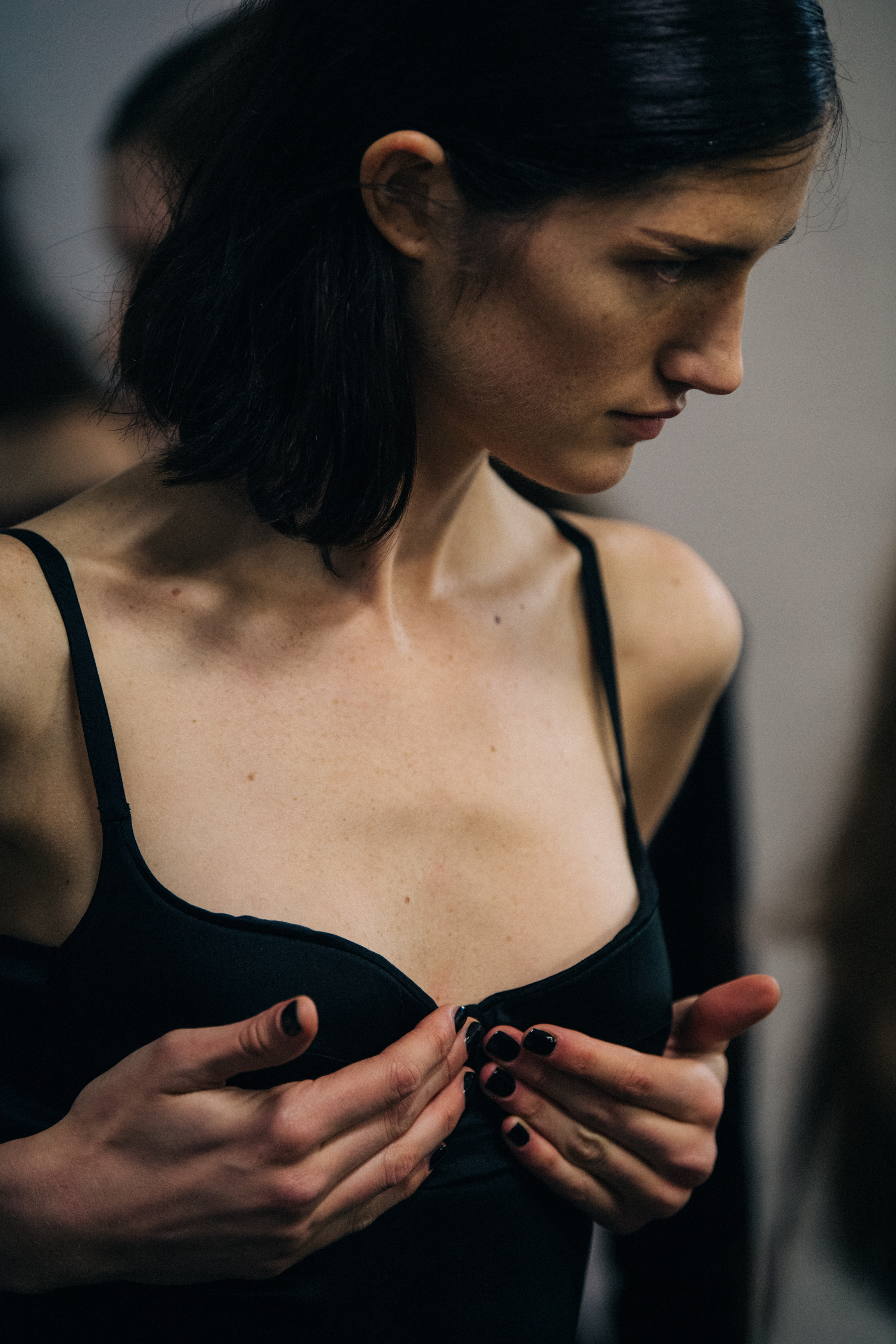 Model wearing black Olivier Theyskens outfit backstage