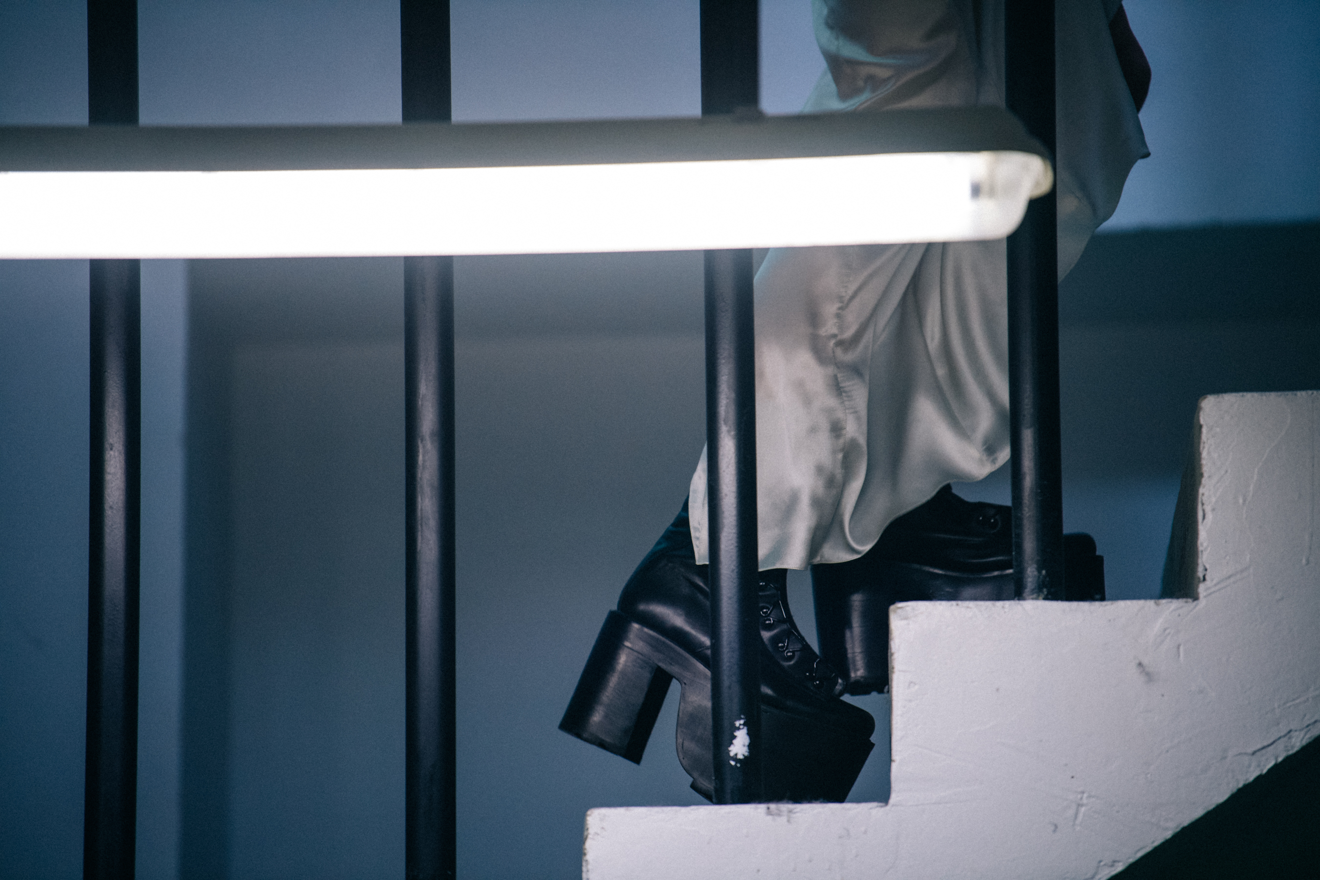 Model wearing big black boots backstage