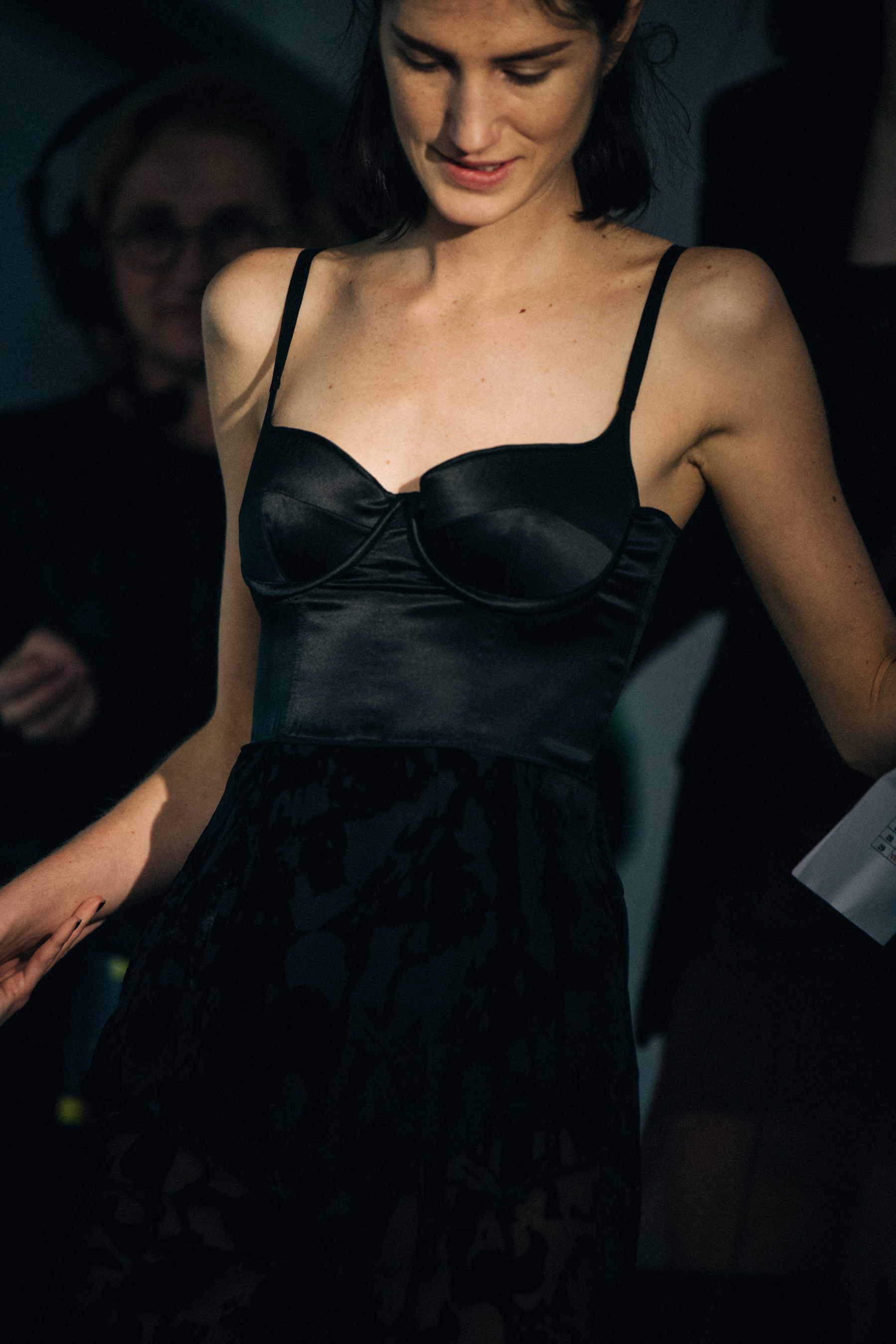 Models wearing black Olivier Theyskens outfit backstage