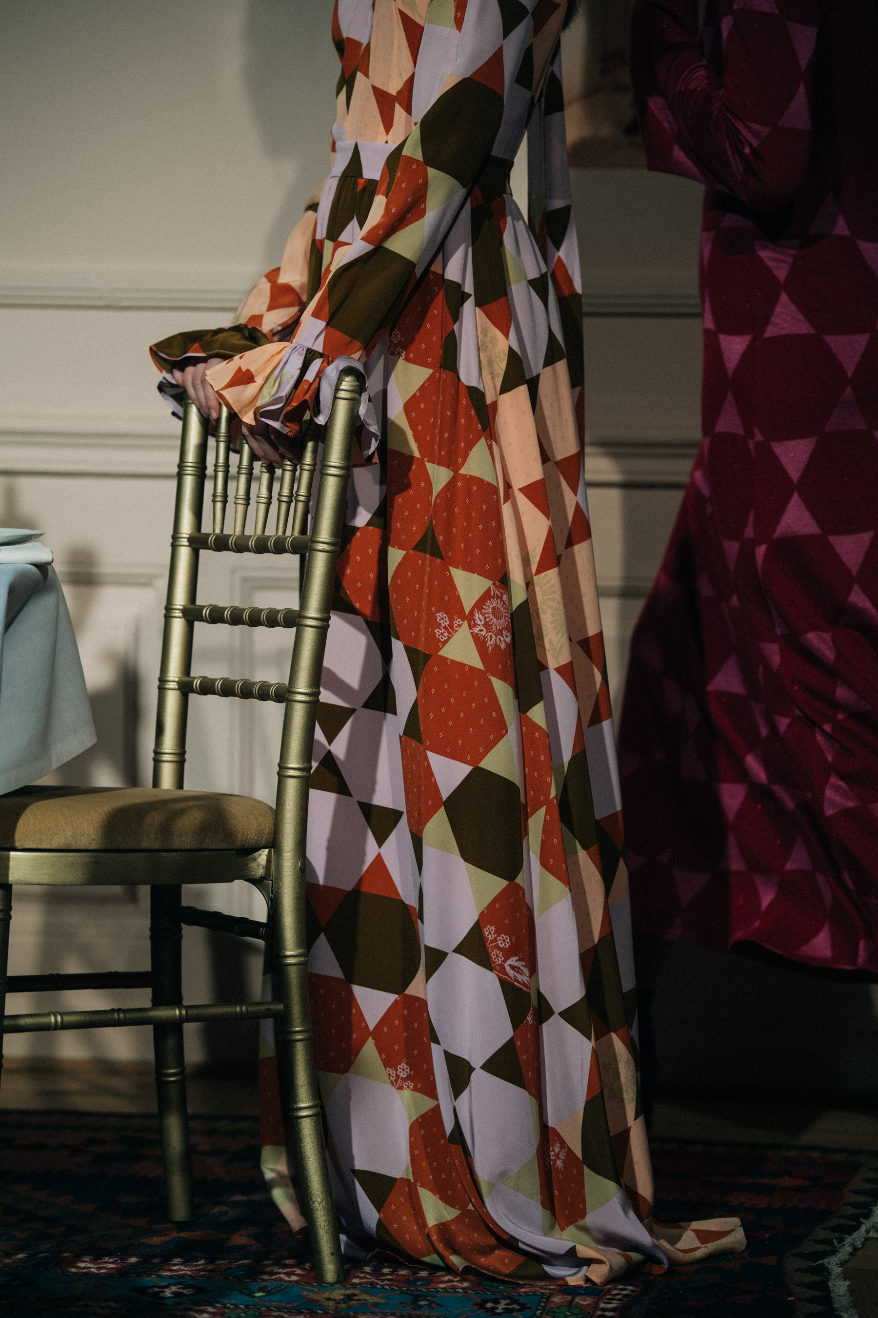 Model wearing pattern dress at Stine Goya