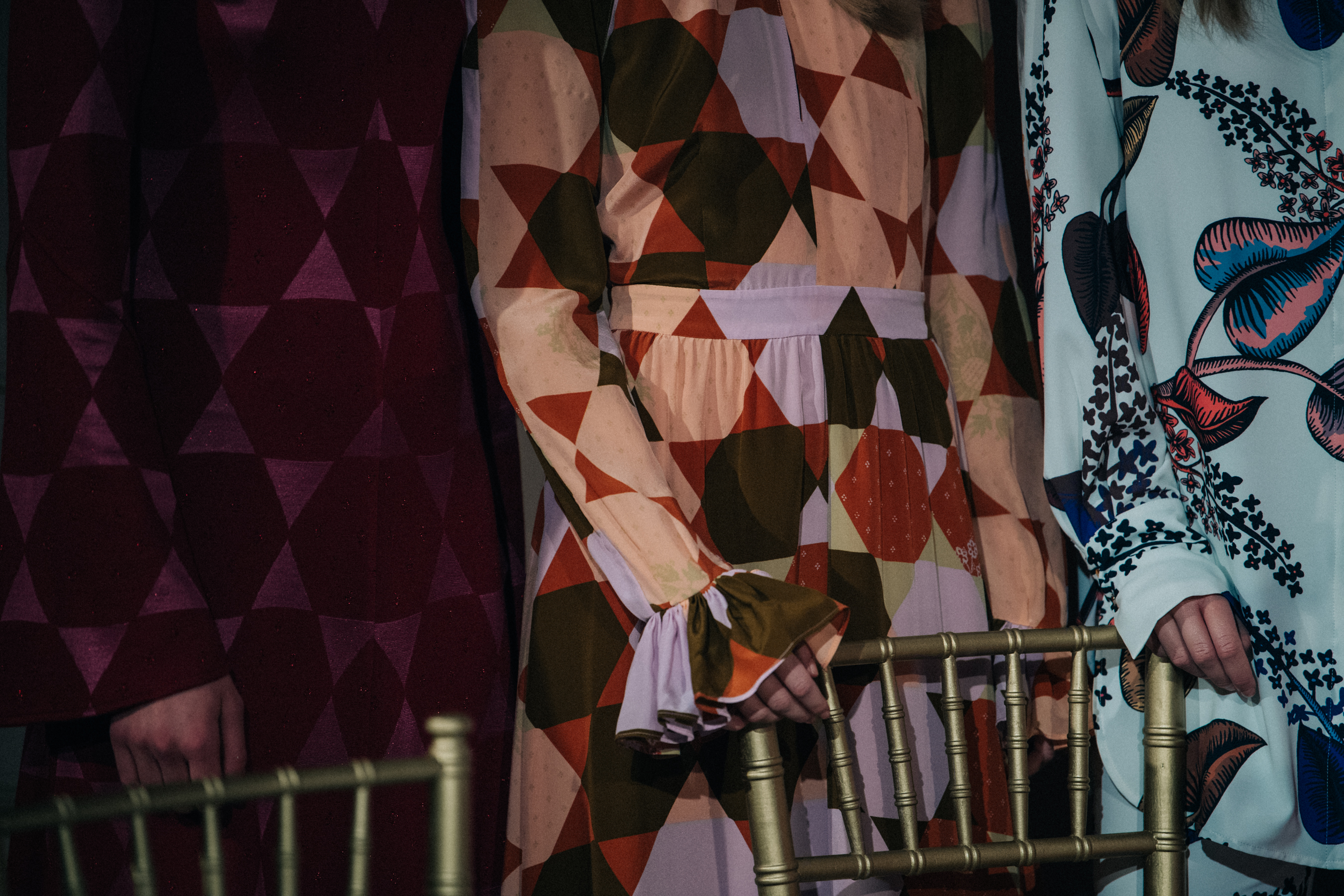 Models wearing colourful dresses at Stine Goya