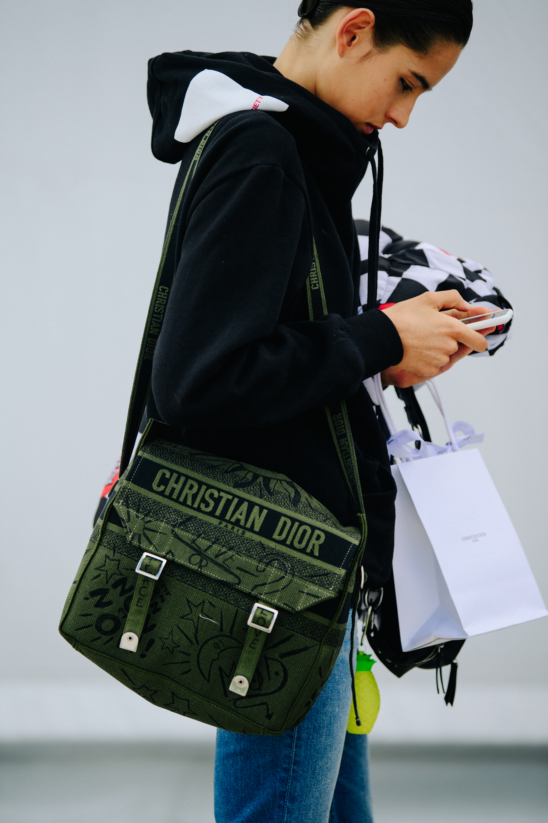 Model carrying Christian Dior bag