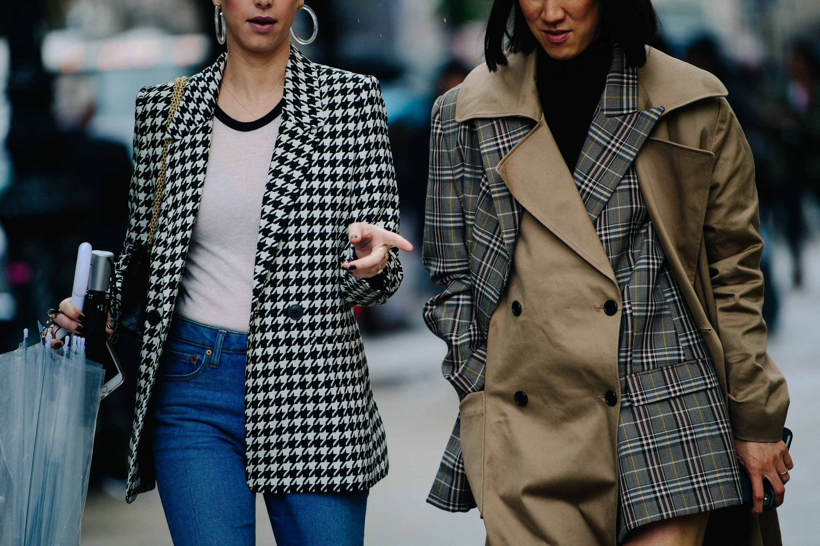 Two women wearing pattern coats
