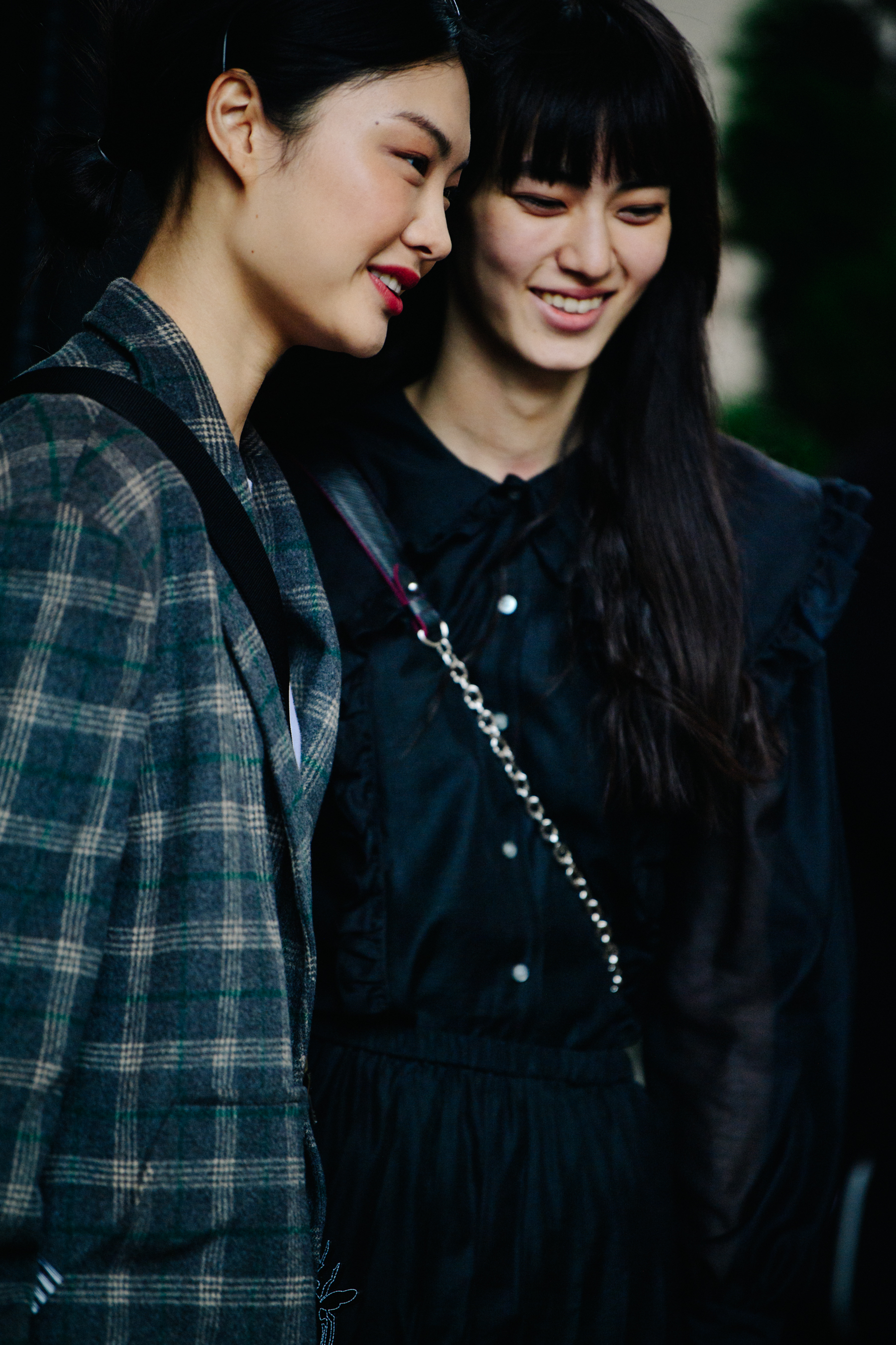 Two Asian models wearing black
