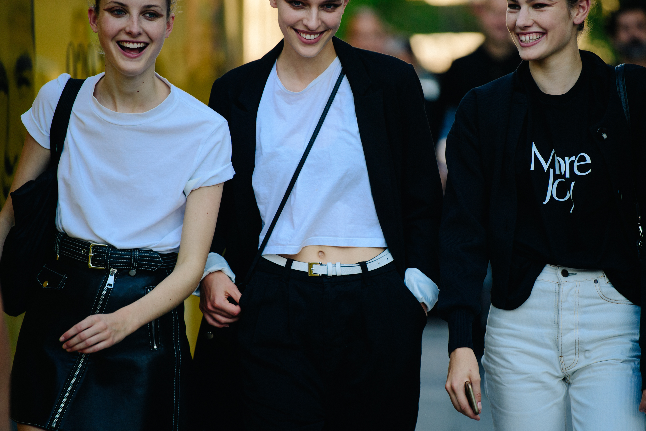 Three models wearing black and white