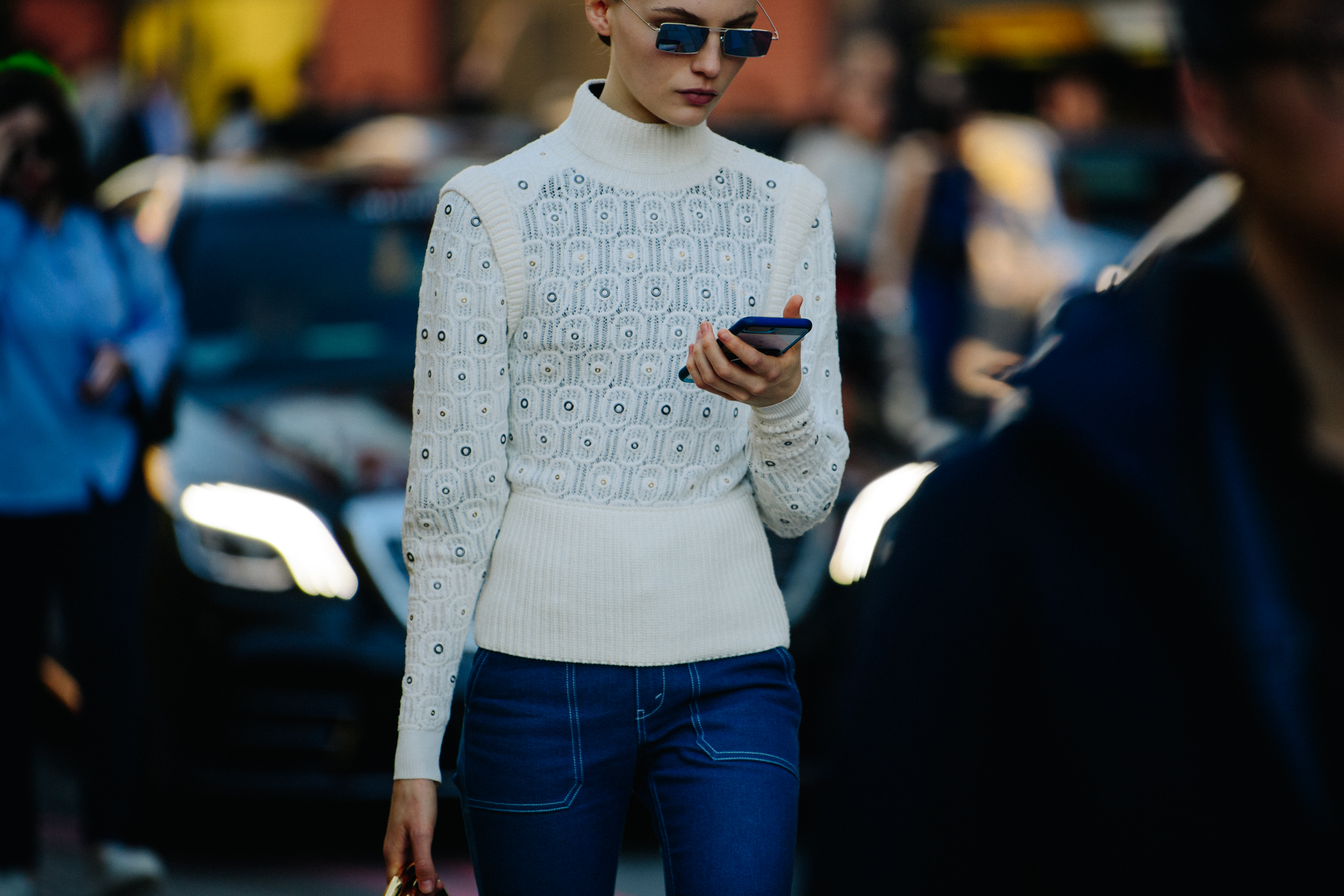 Model wearing blue sunglasses