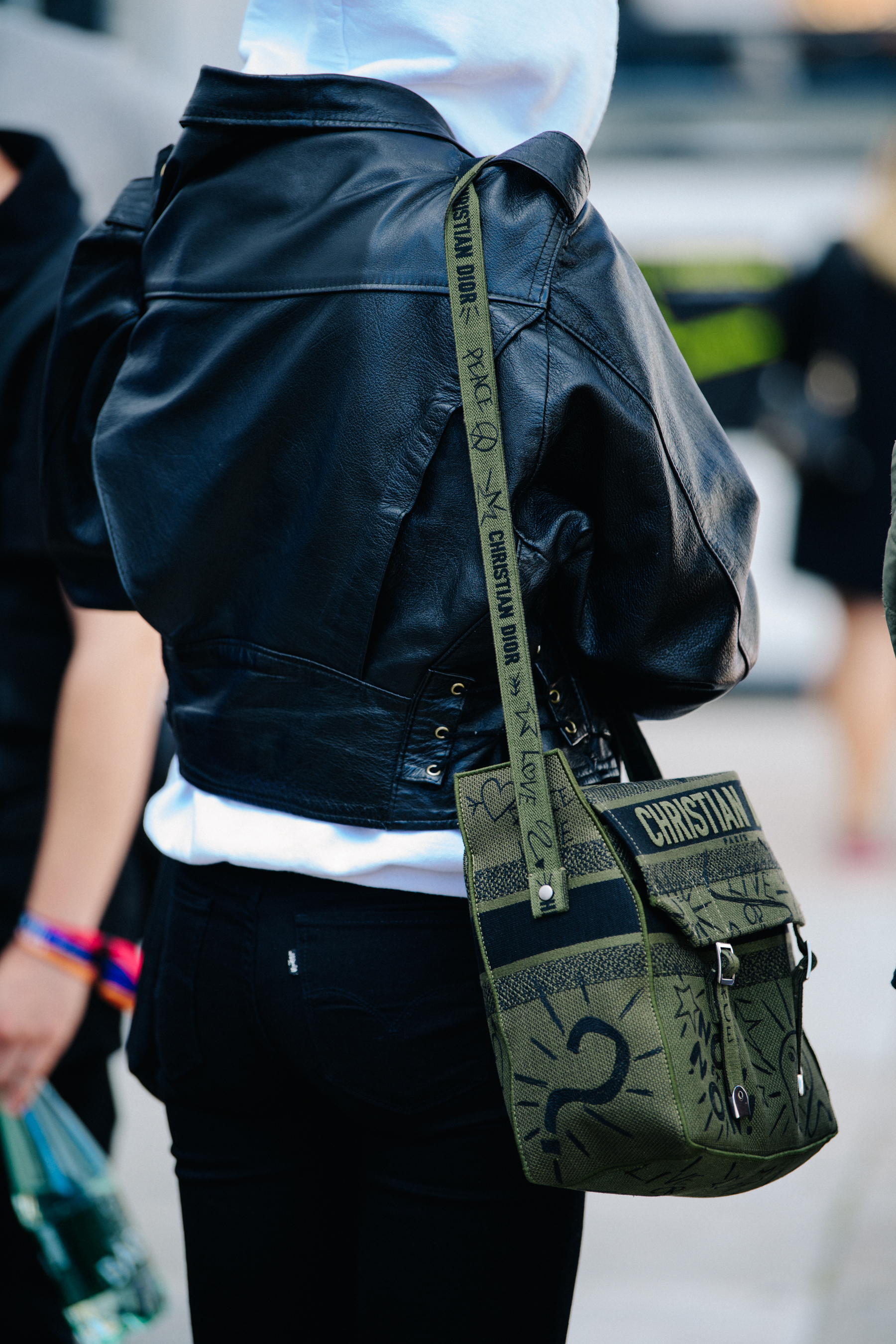 Model carrying Christian Dior bag