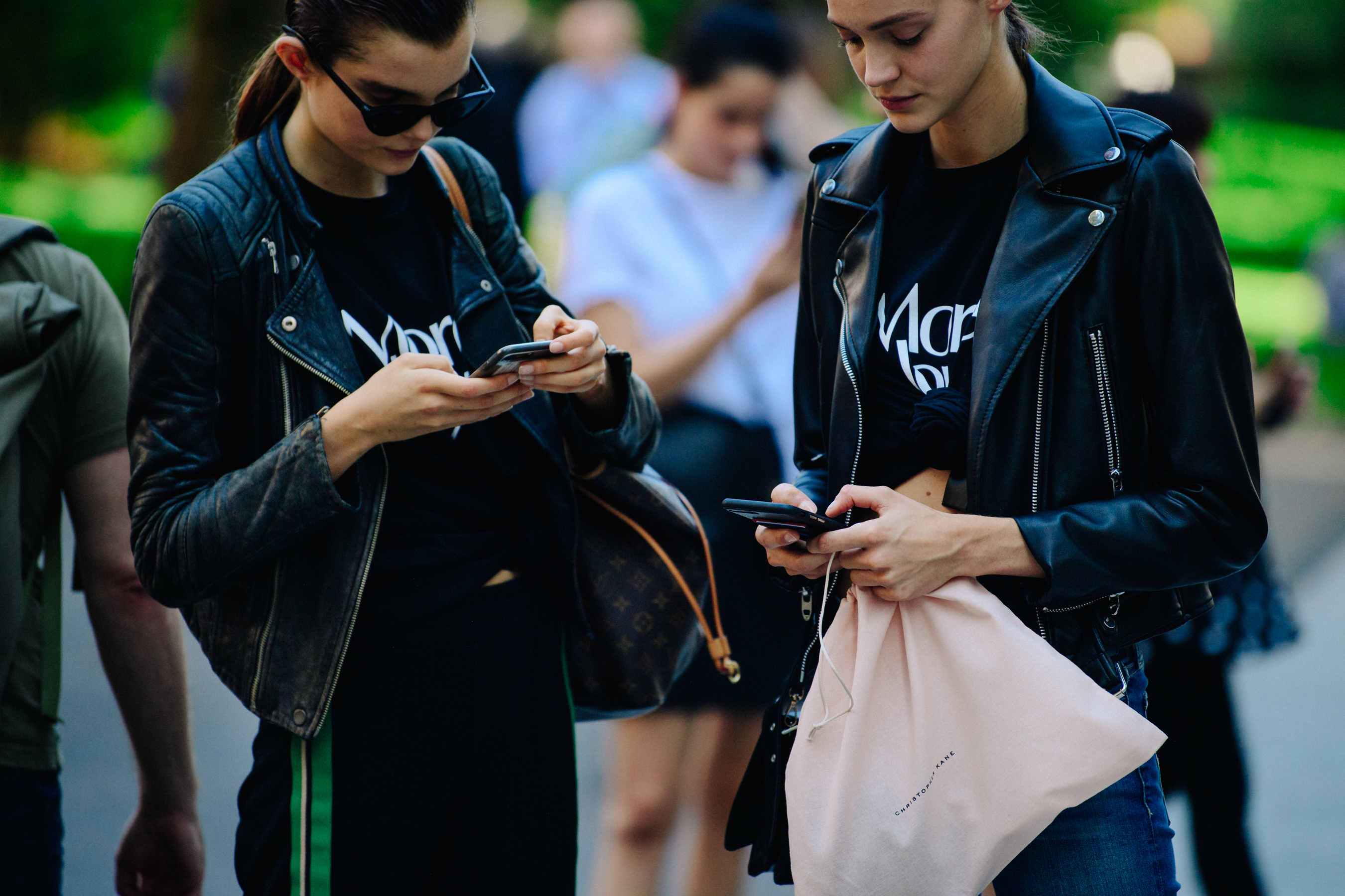 Two models wearing leather jackets