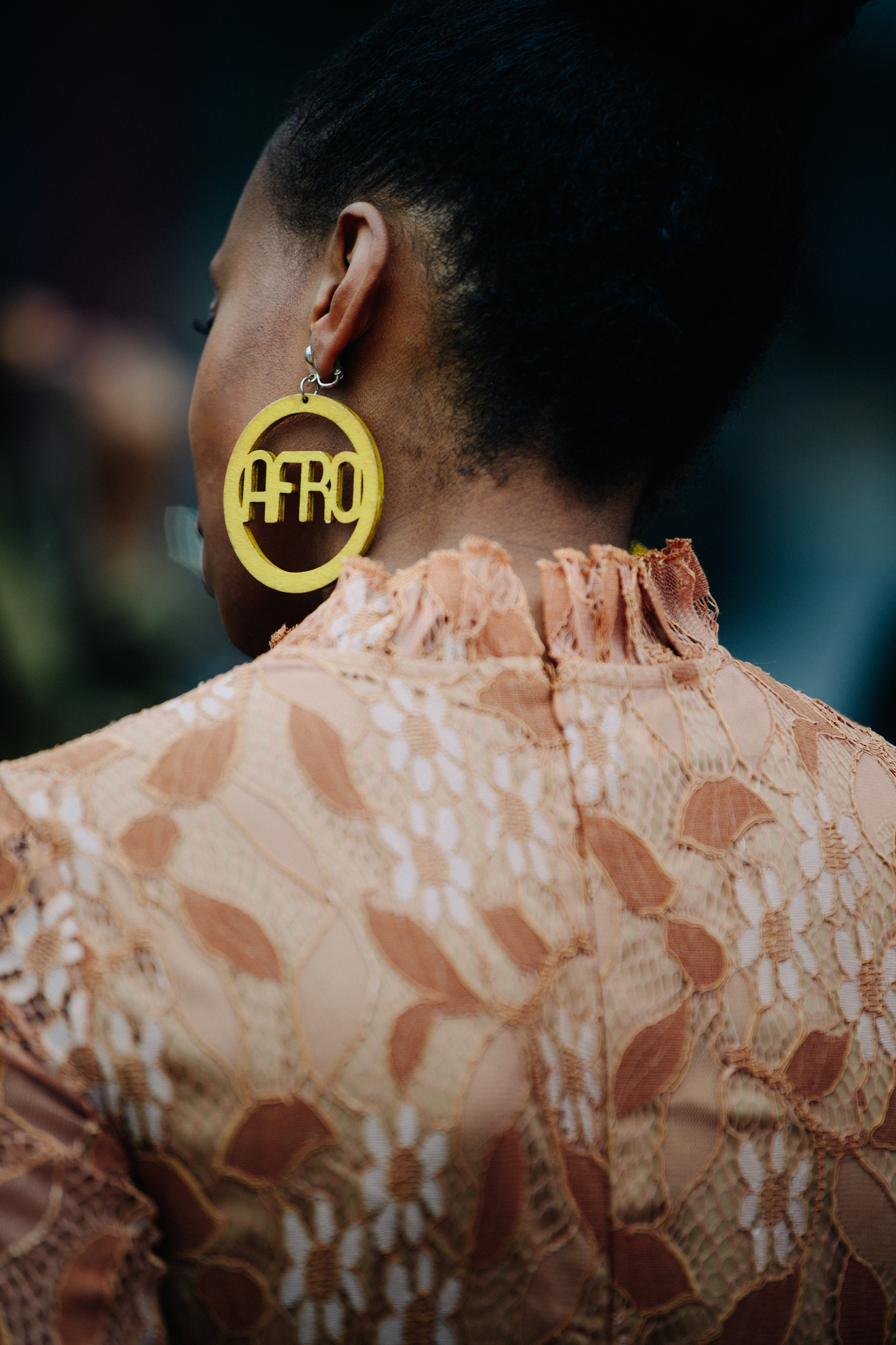 Woman wearing large gold earring