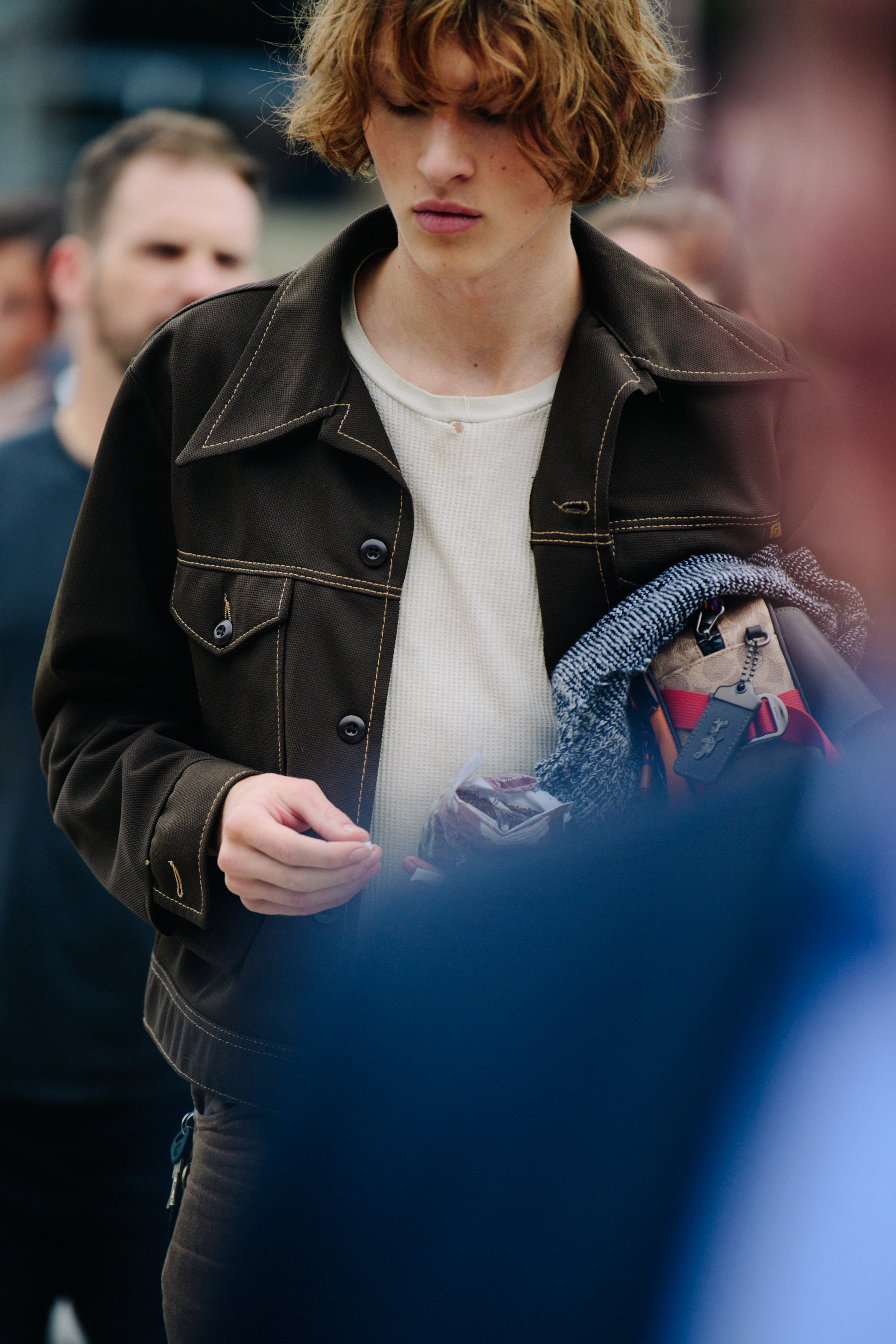 Man wearing dark brown jacket