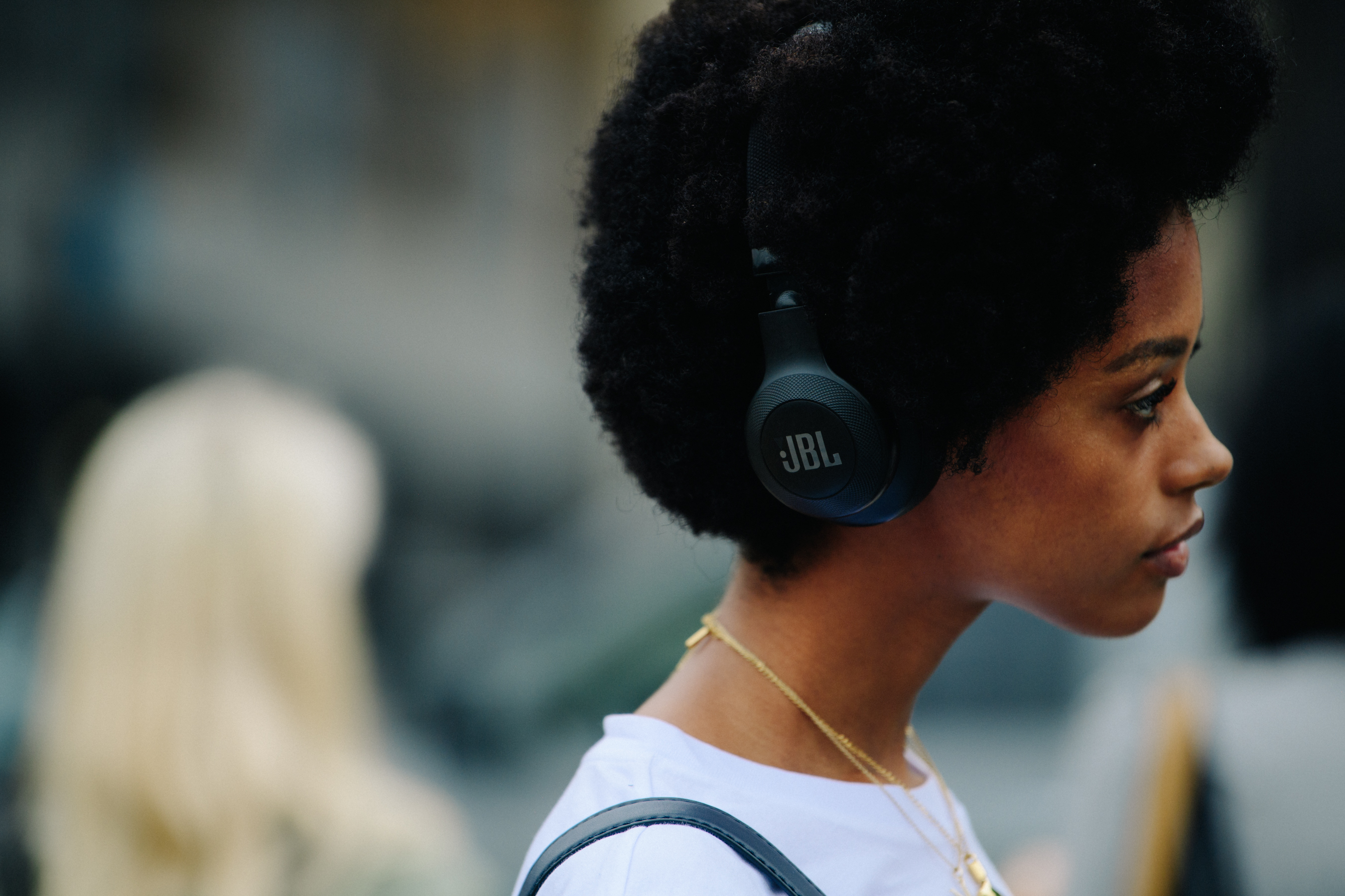 Model wearing JBL headphones