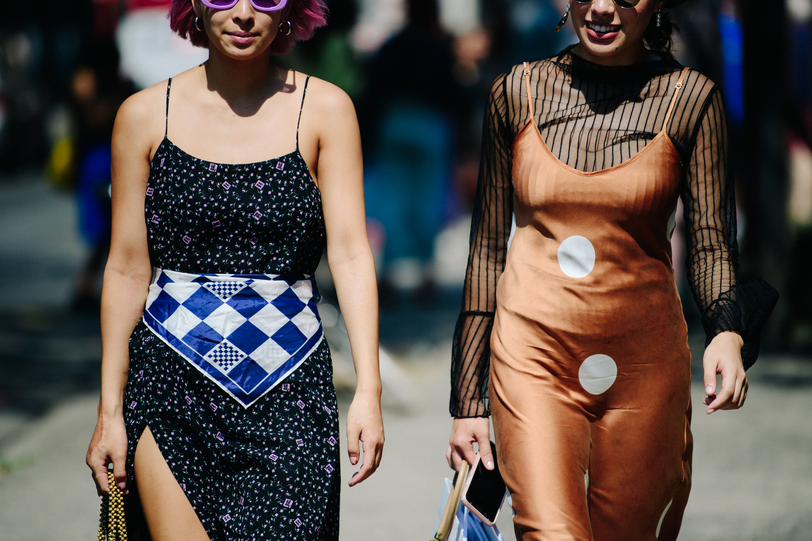 Two women wearing summer dresses