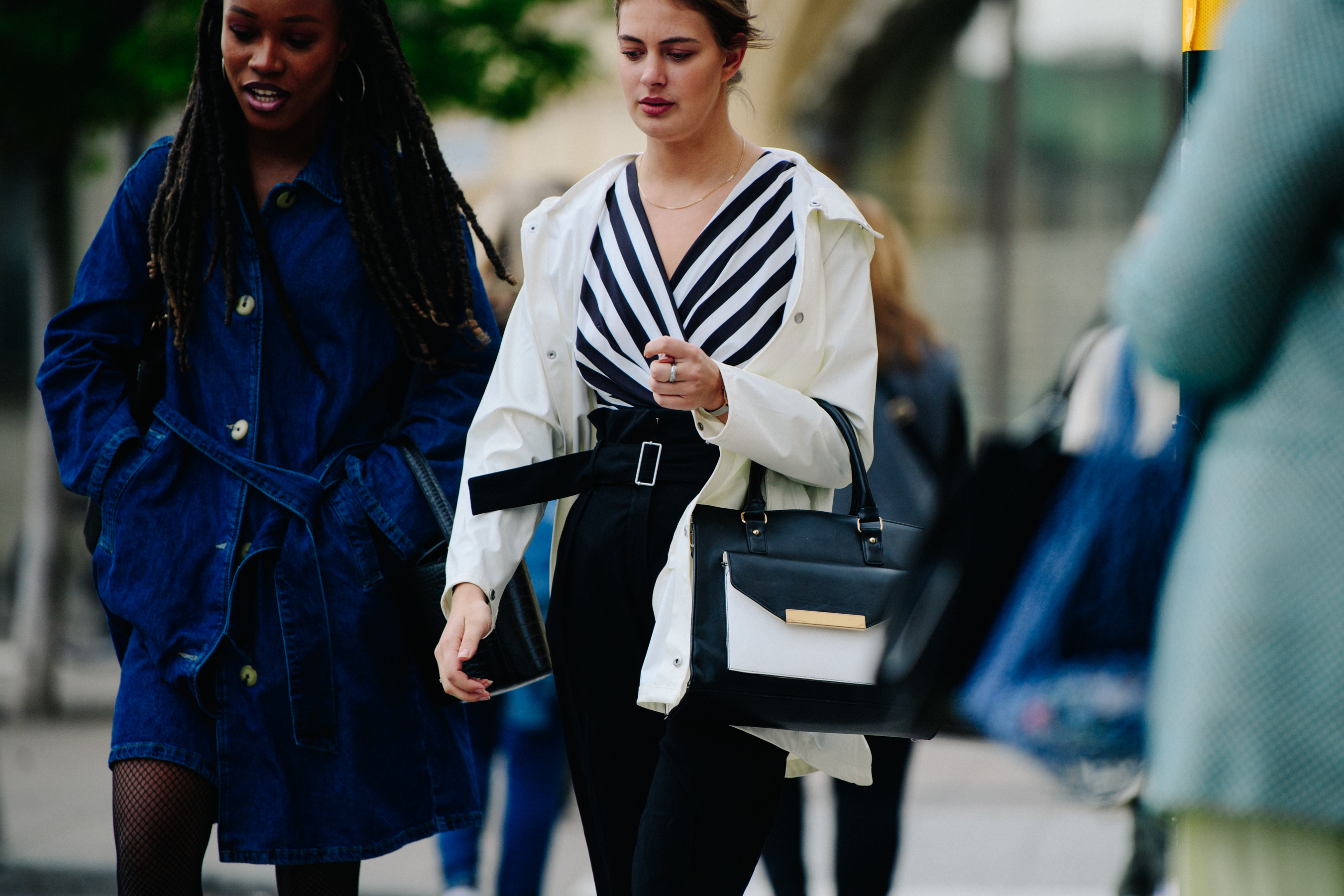 Two women wearing light jackets