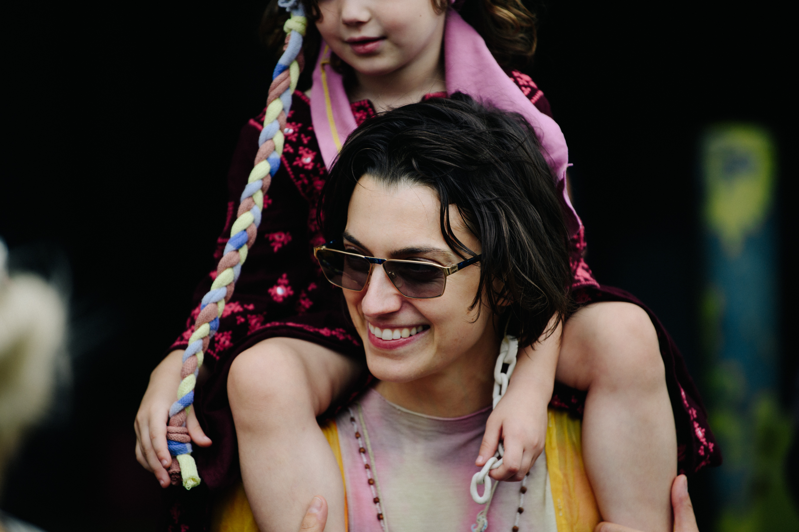 Woman carrying daughter