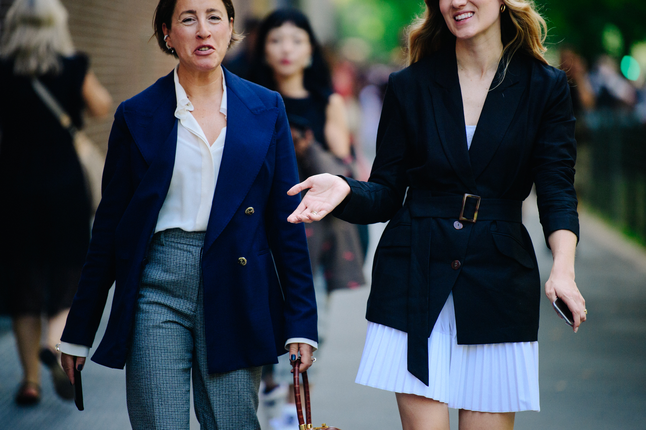 Two women wearing dark jackets