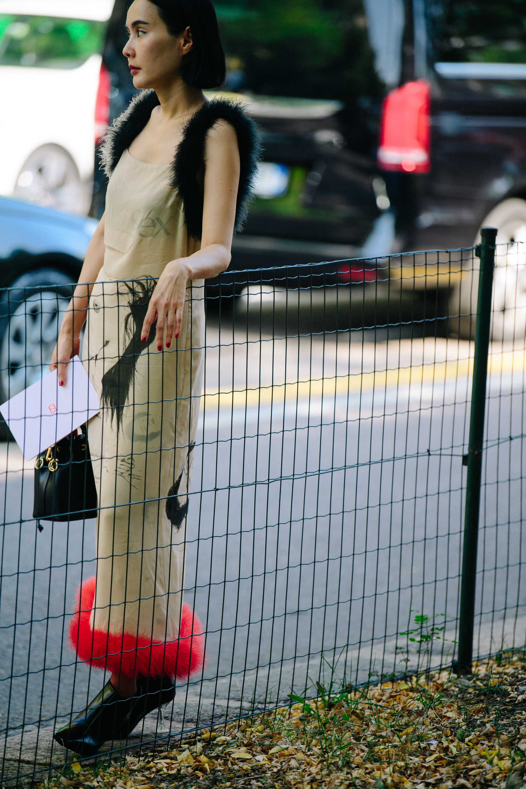 Woman wearing red fur trim dress