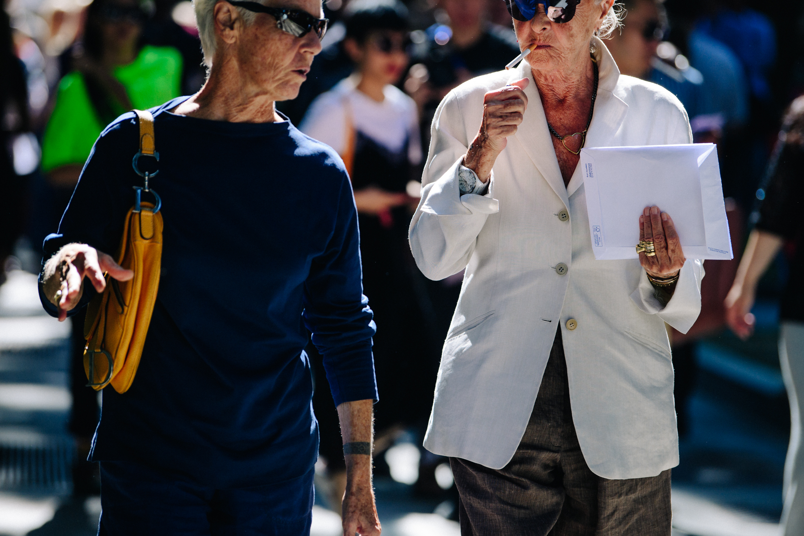 Two elderly women wearing sunglasses