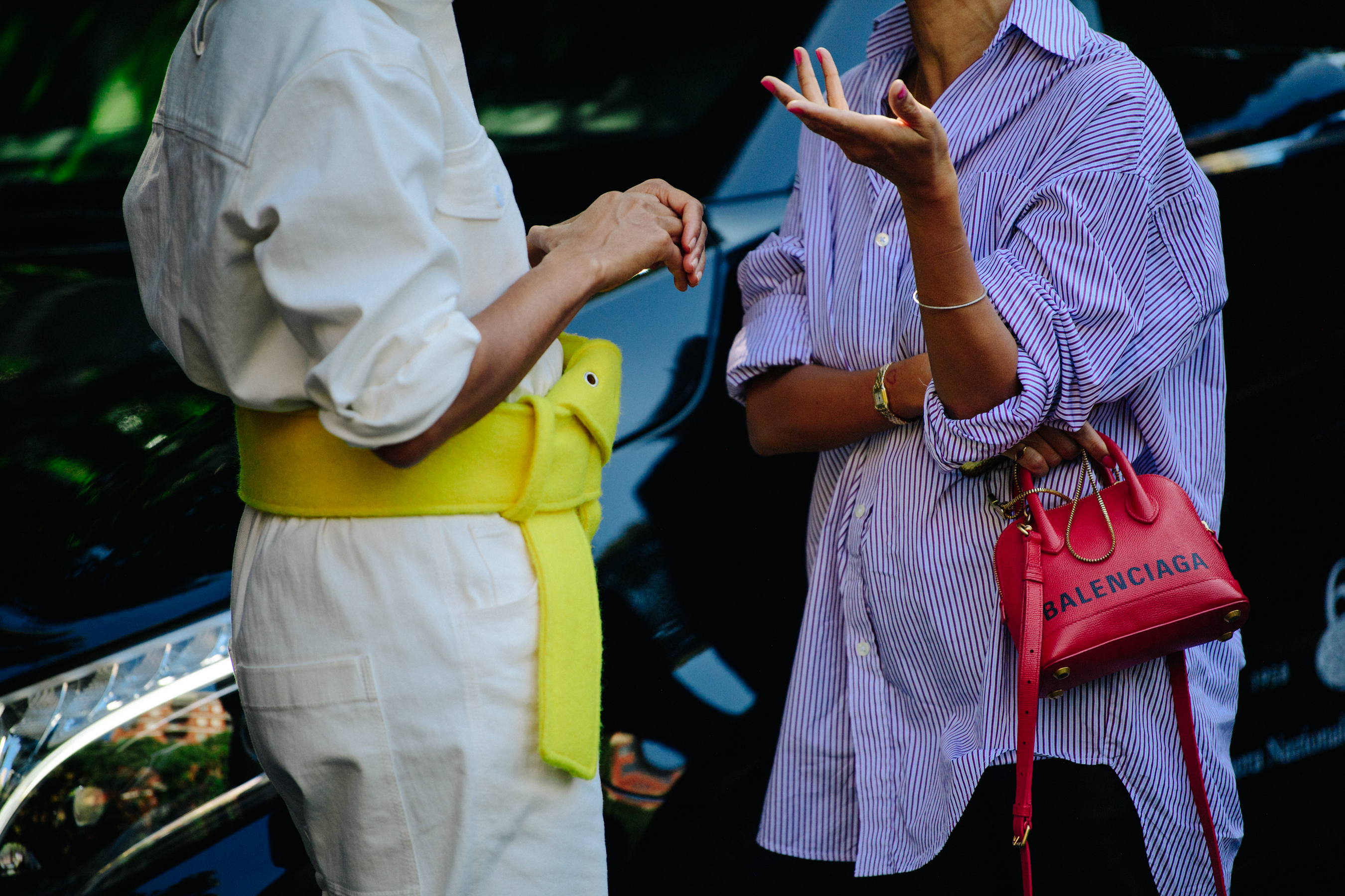 Two women wearing fashionable shirts