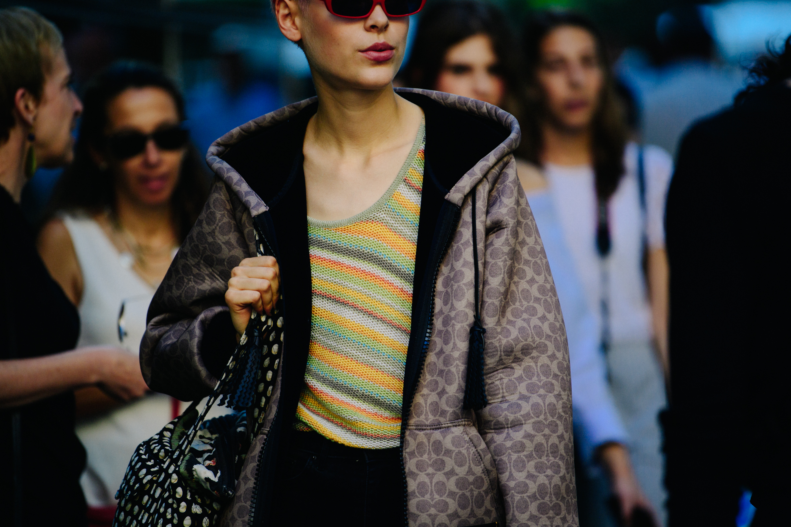 Model wearing brown hoodie