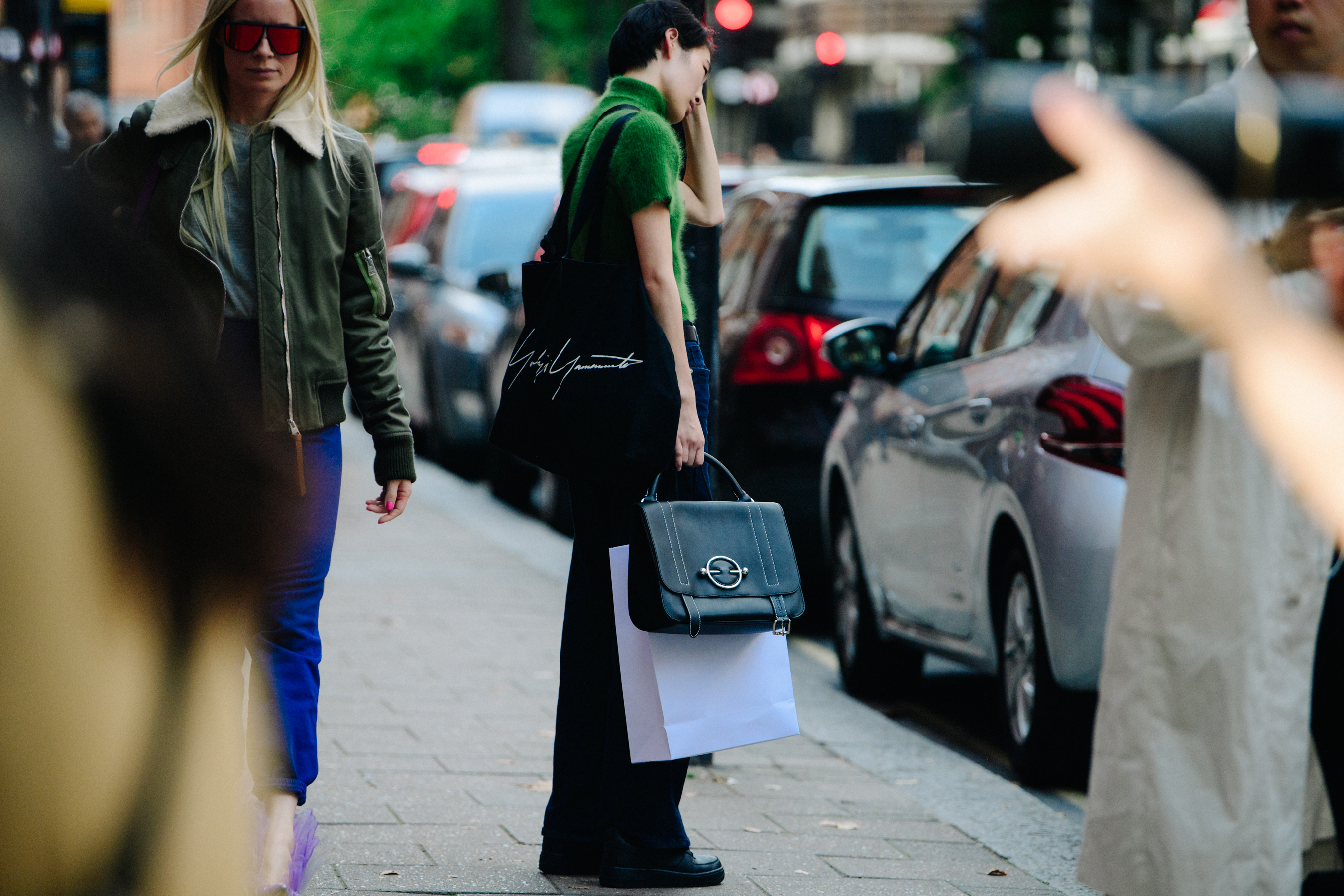 Model carrying black bag
