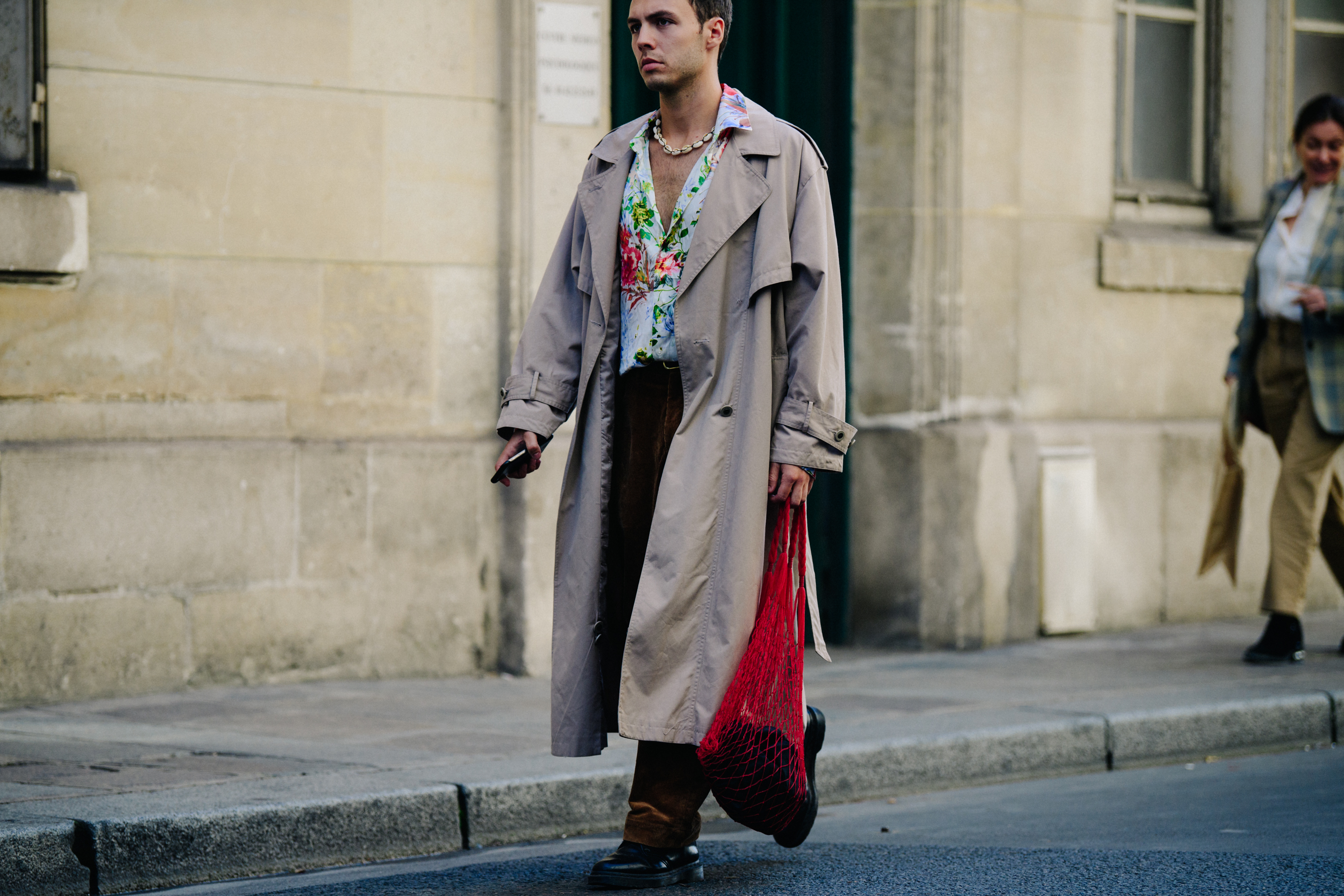 Man wearing long brown coat