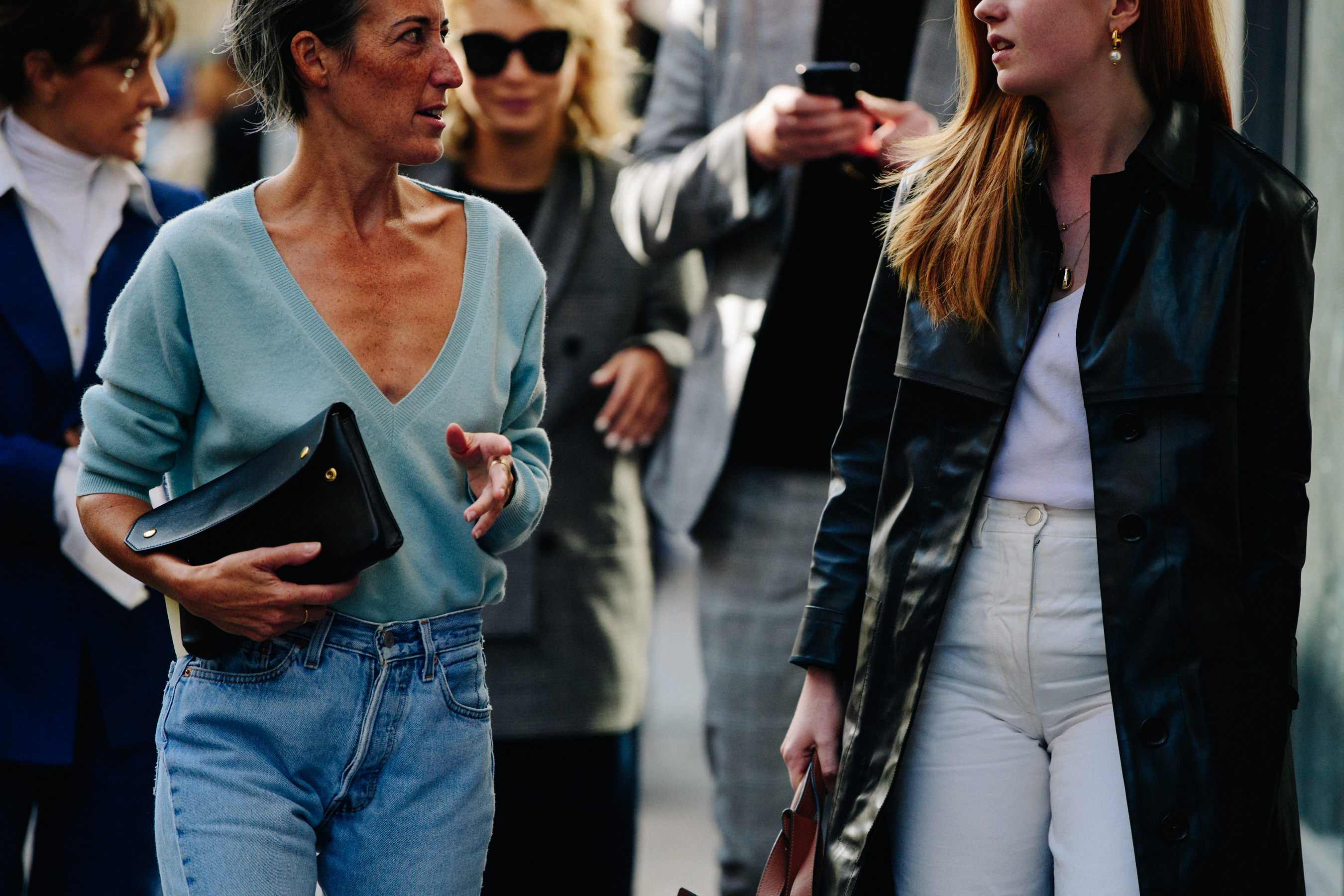 Two women wearing black leather