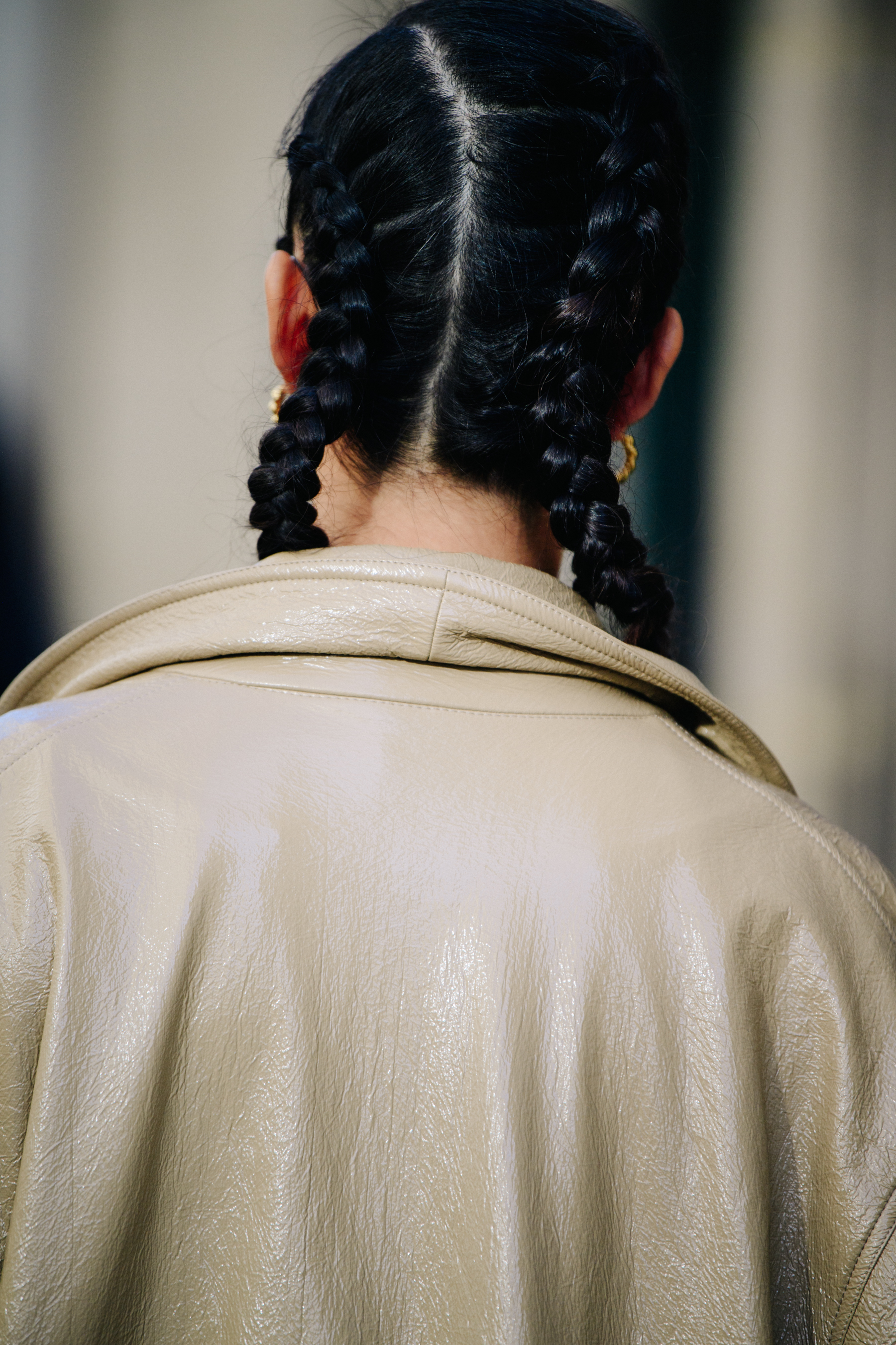 Woman wearing tan leather coat